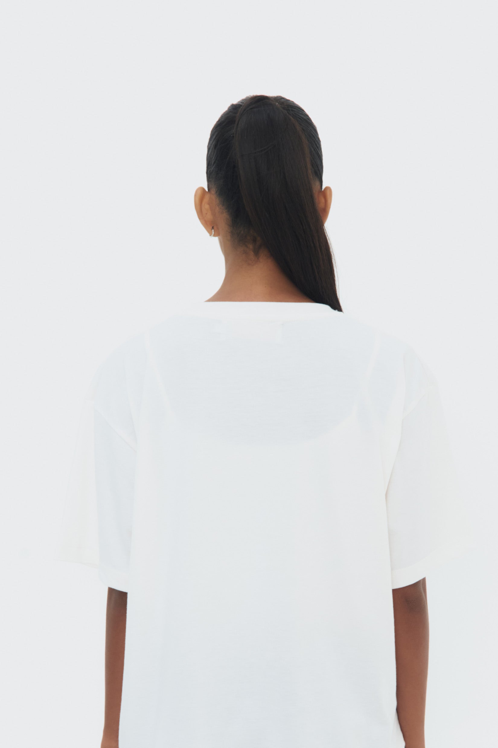 Back view la Isla T-Shirt by Olga Fisch – cotton tee with art-inspired print