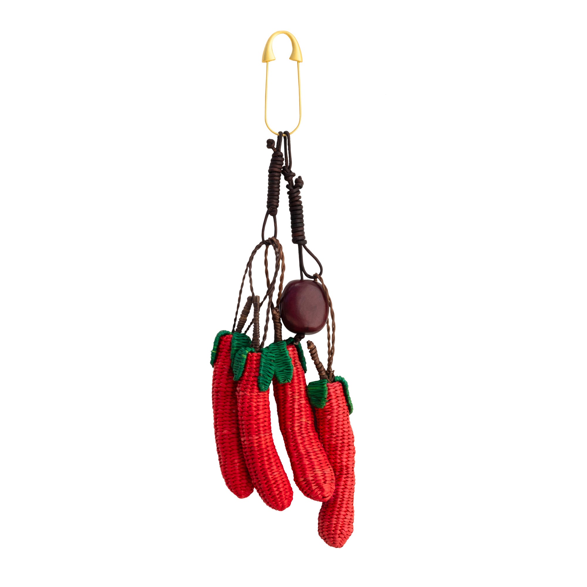 Ajíes Toquilla Straw Bag Charm with handwoven red chili peppers, green leaves, tagua nut, leather cords and gold-tone metal clip.