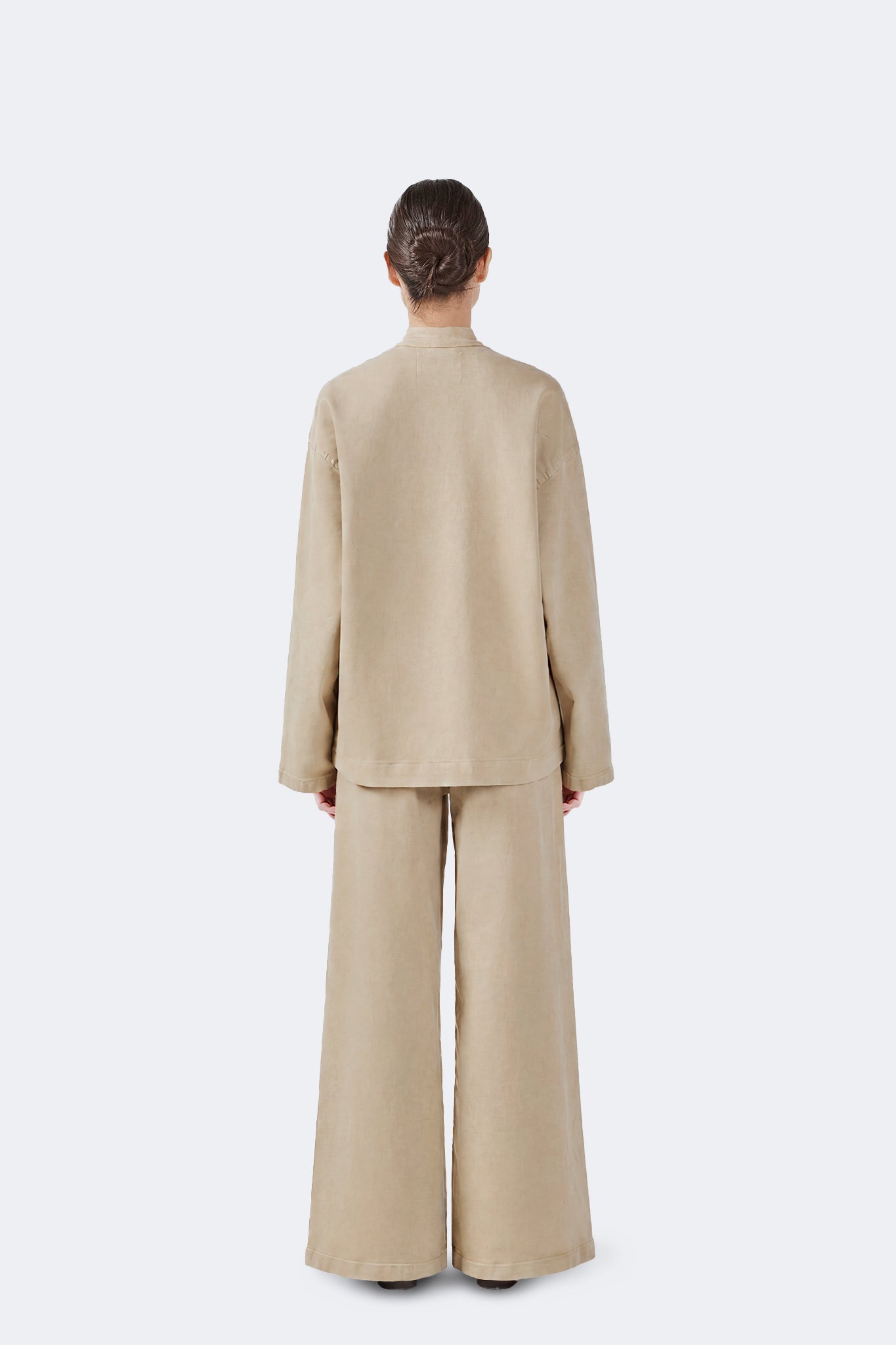 Back view of the Allpa Mandarin Jacket in Cream featuring a relaxed silhouette and minimalist design.