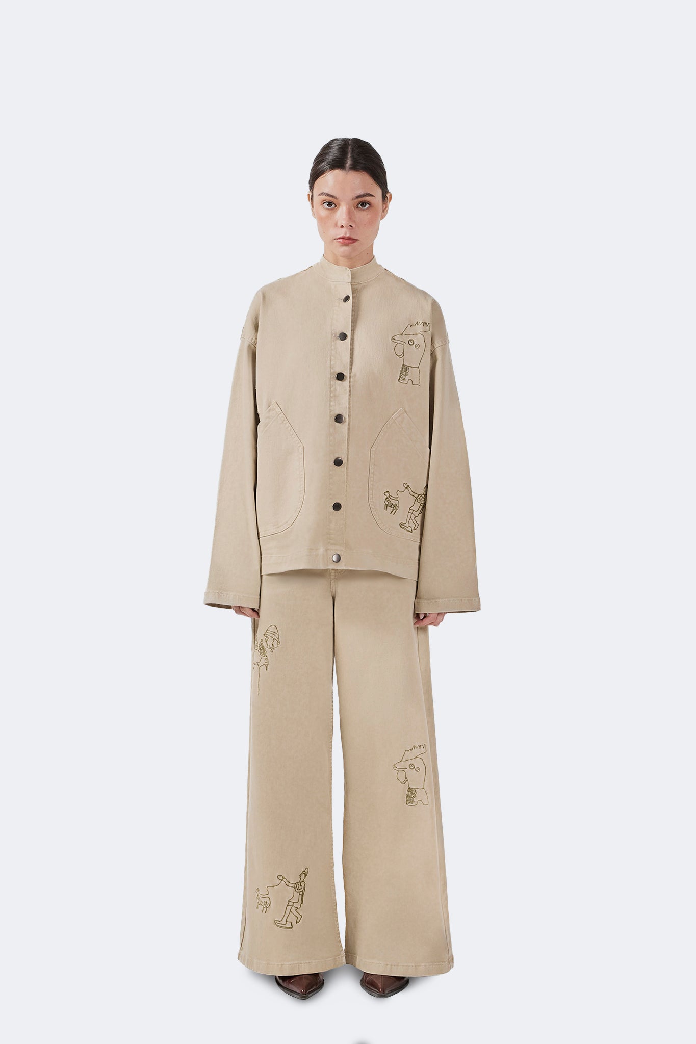 Front view of the Allpa Mandarin Jacket in Cream crafted from cotton denim with a relaxed workwear-inspired silhouette.