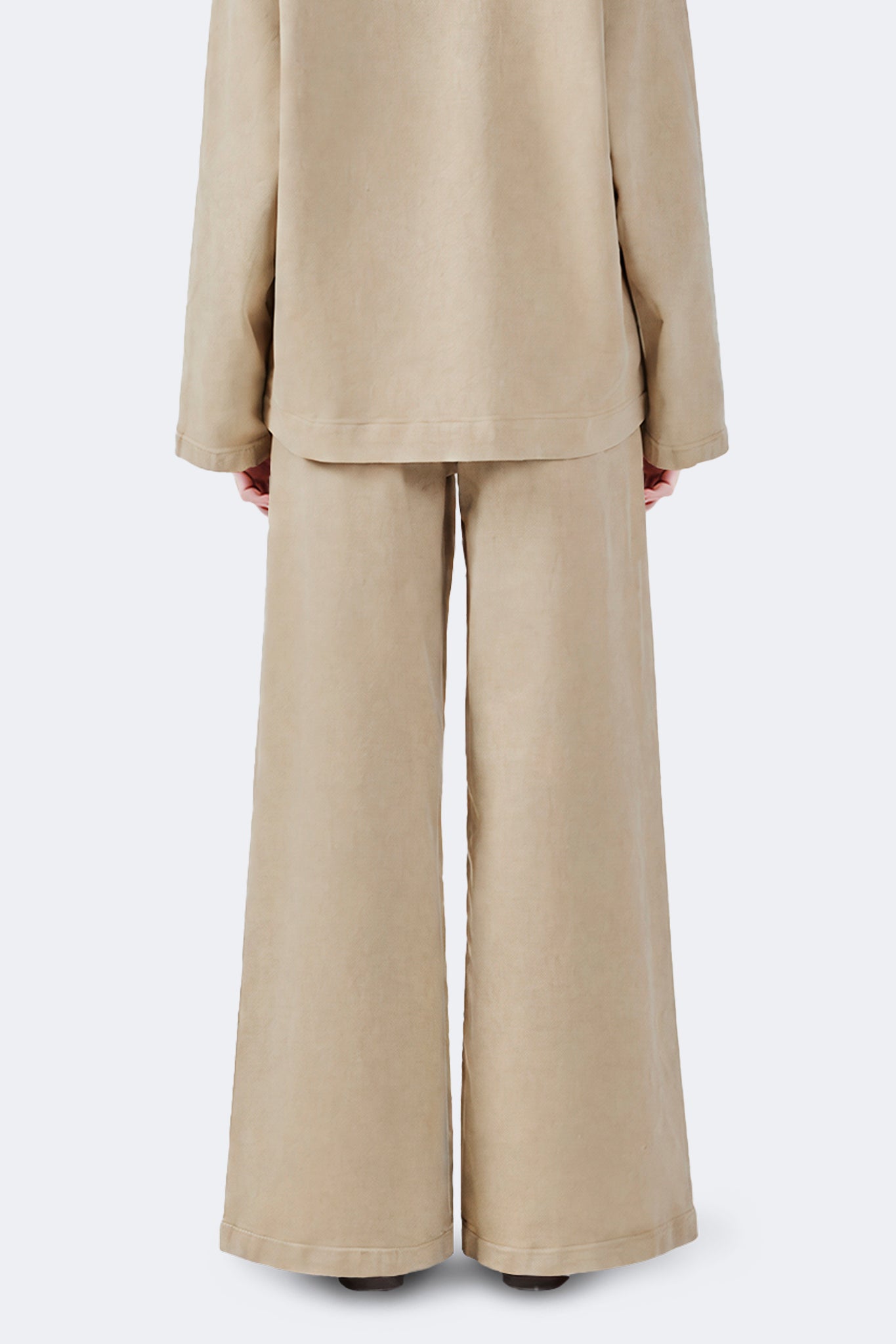 Back detail of the Allpa Cream wide-leg cotton denim jeans featuring a relaxed silhouette.
