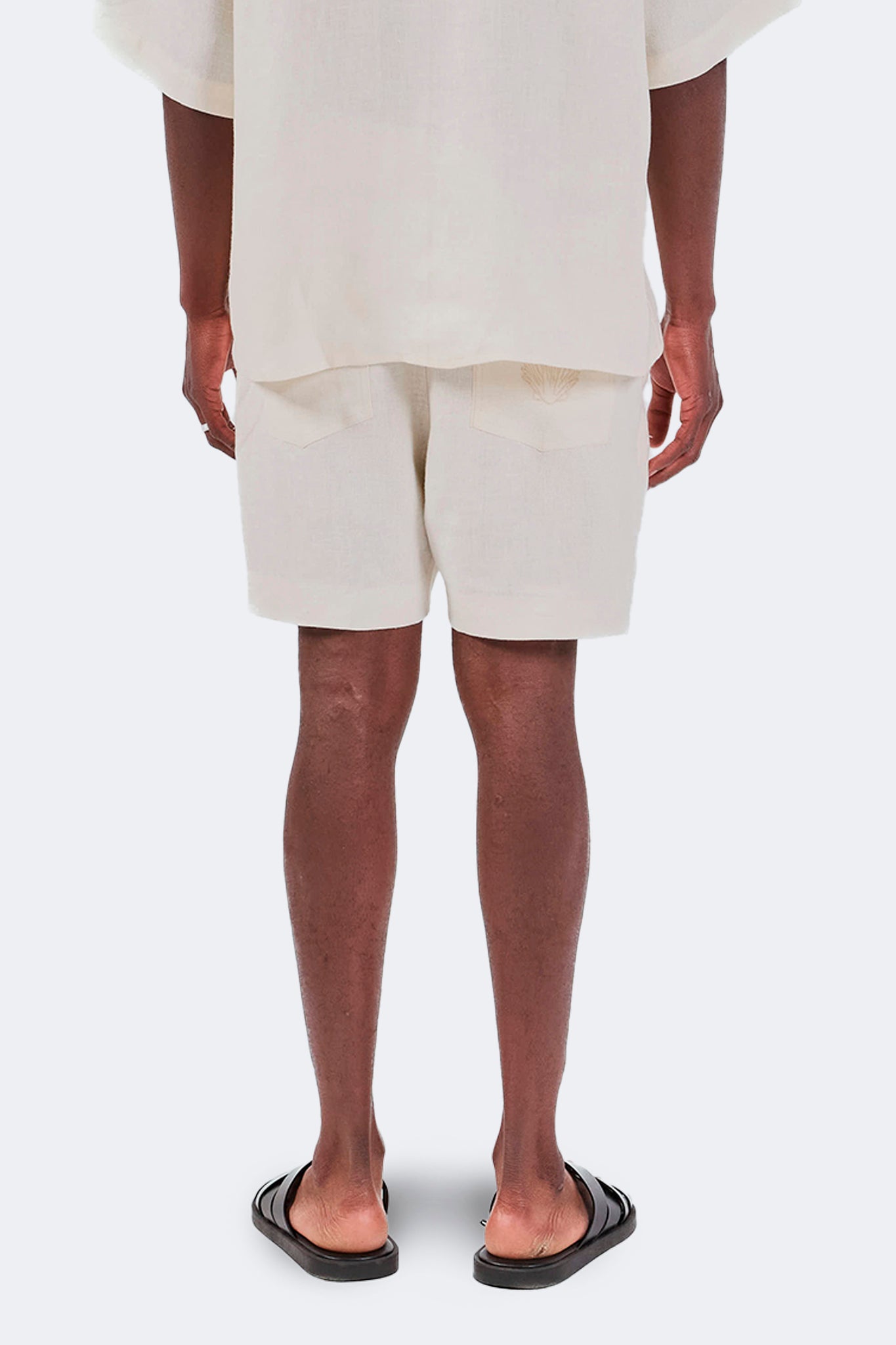 Back detail of Baltra Linen Shorts Ivory featuring archive-inspired embroidery and lightweight linen.