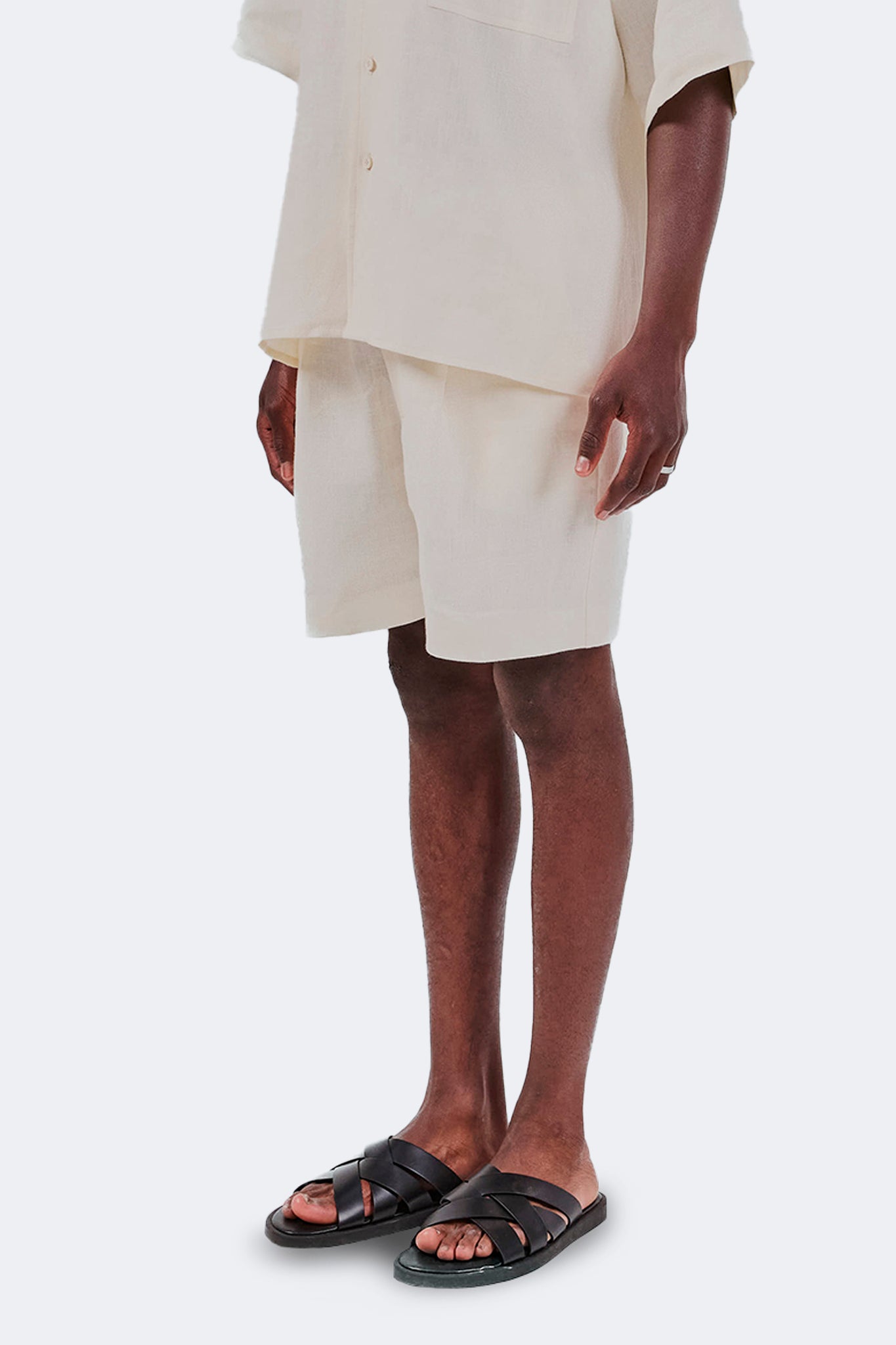 Side detail of Baltra Linen Shorts Ivory highlighting the natural drape of lightweight linen.