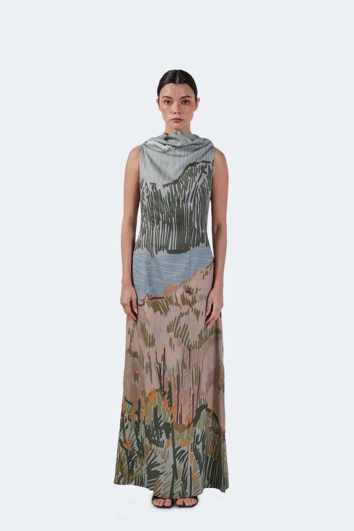Front view of the Bruma Draped Neck Dress with a sleeveless silhouette, draped neckline, and full-length landscape-inspired print.