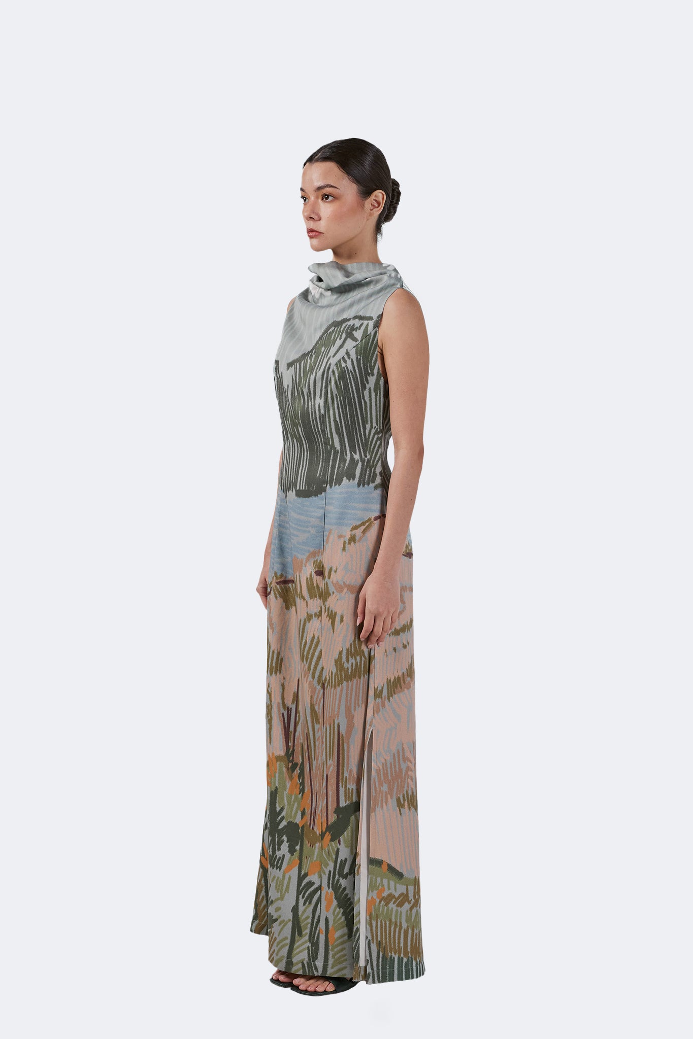 Side view of the Bruma Draped Neck Dress showcasing the fluid silhouette, side slit, and landscape-inspired artwork.