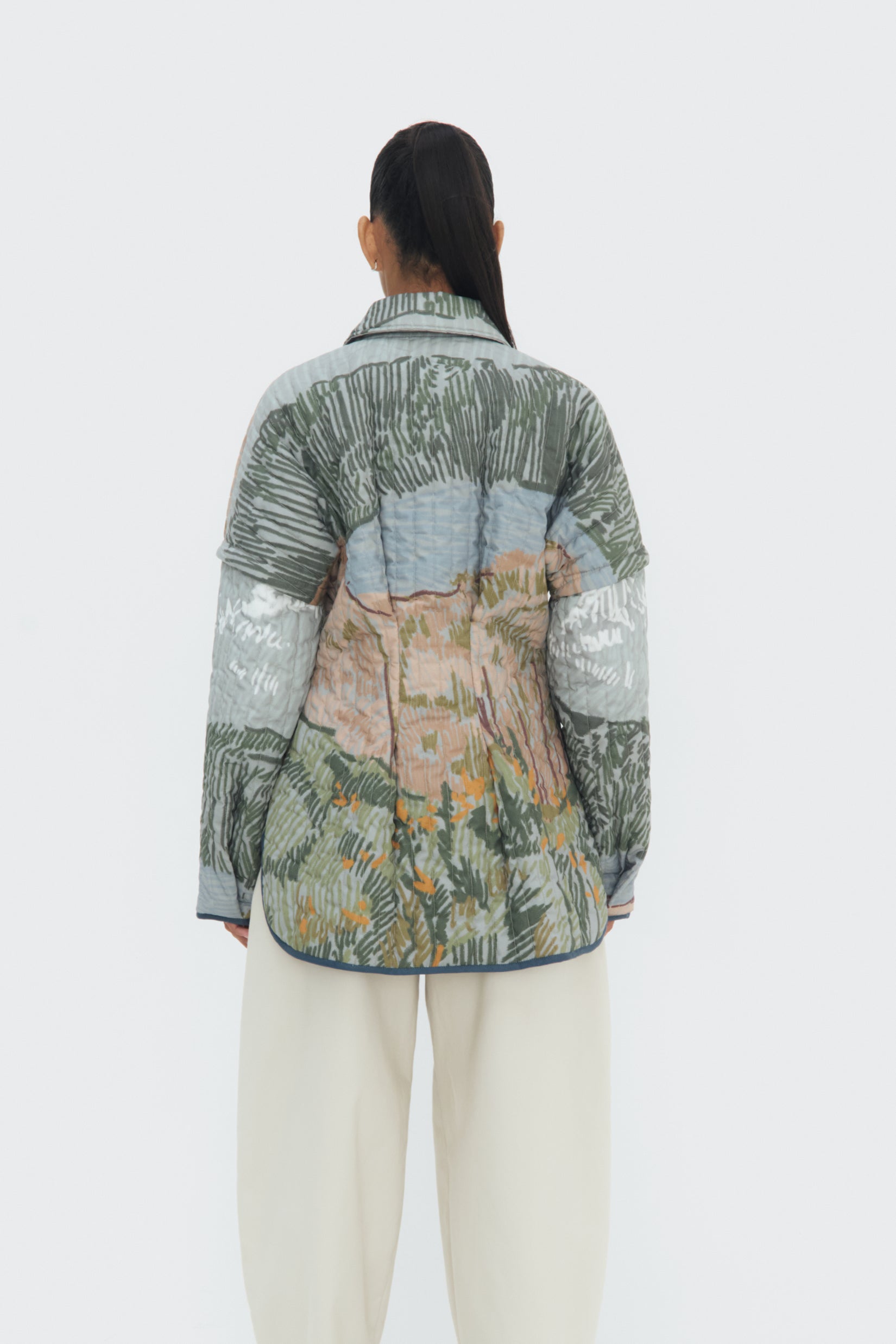 Back view of Bruma Quilted Jacket – oversized fit and vertical quilted stitching