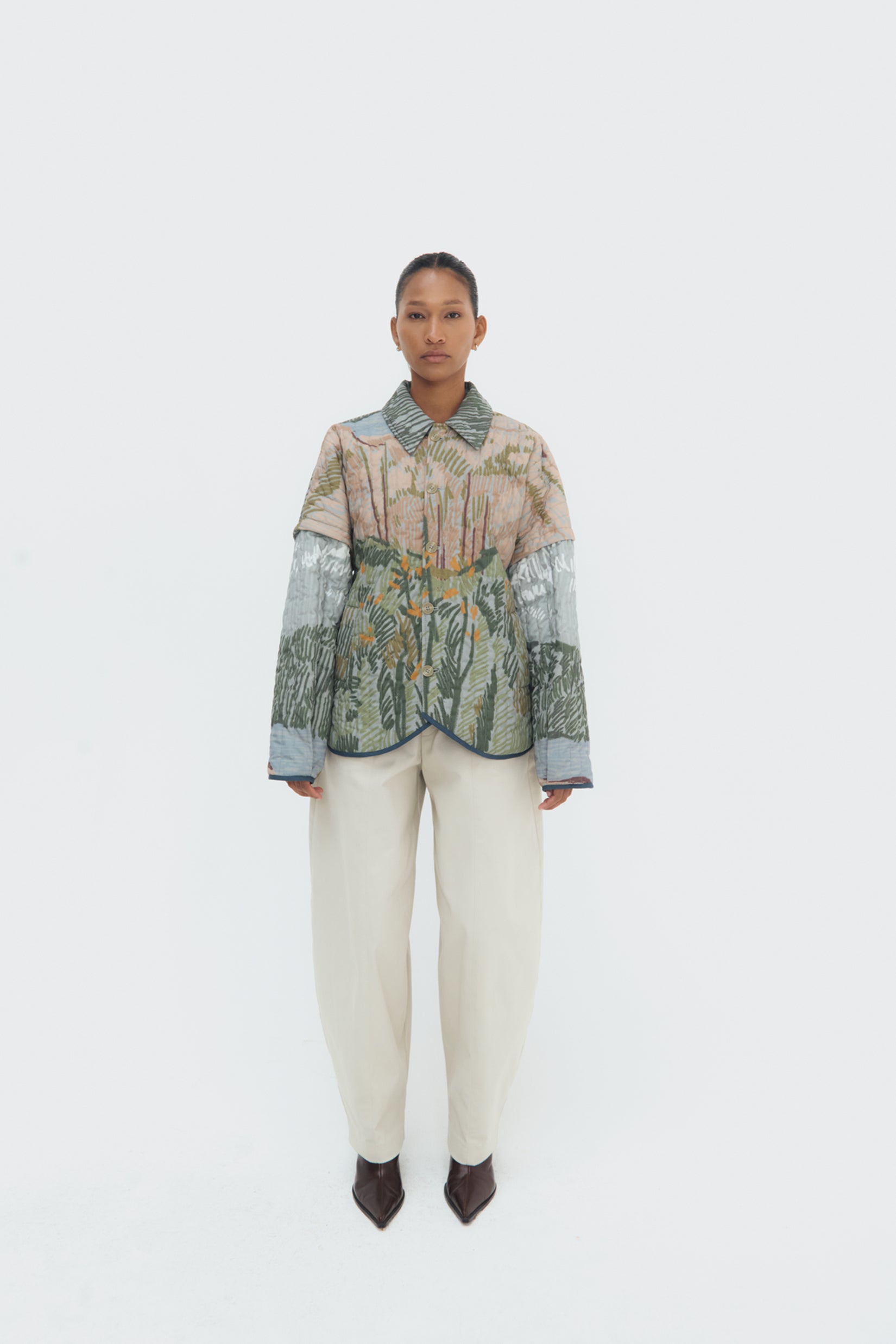 Front view of Bruma Quilted Jacket – oversized fit and vertical quilted stitching