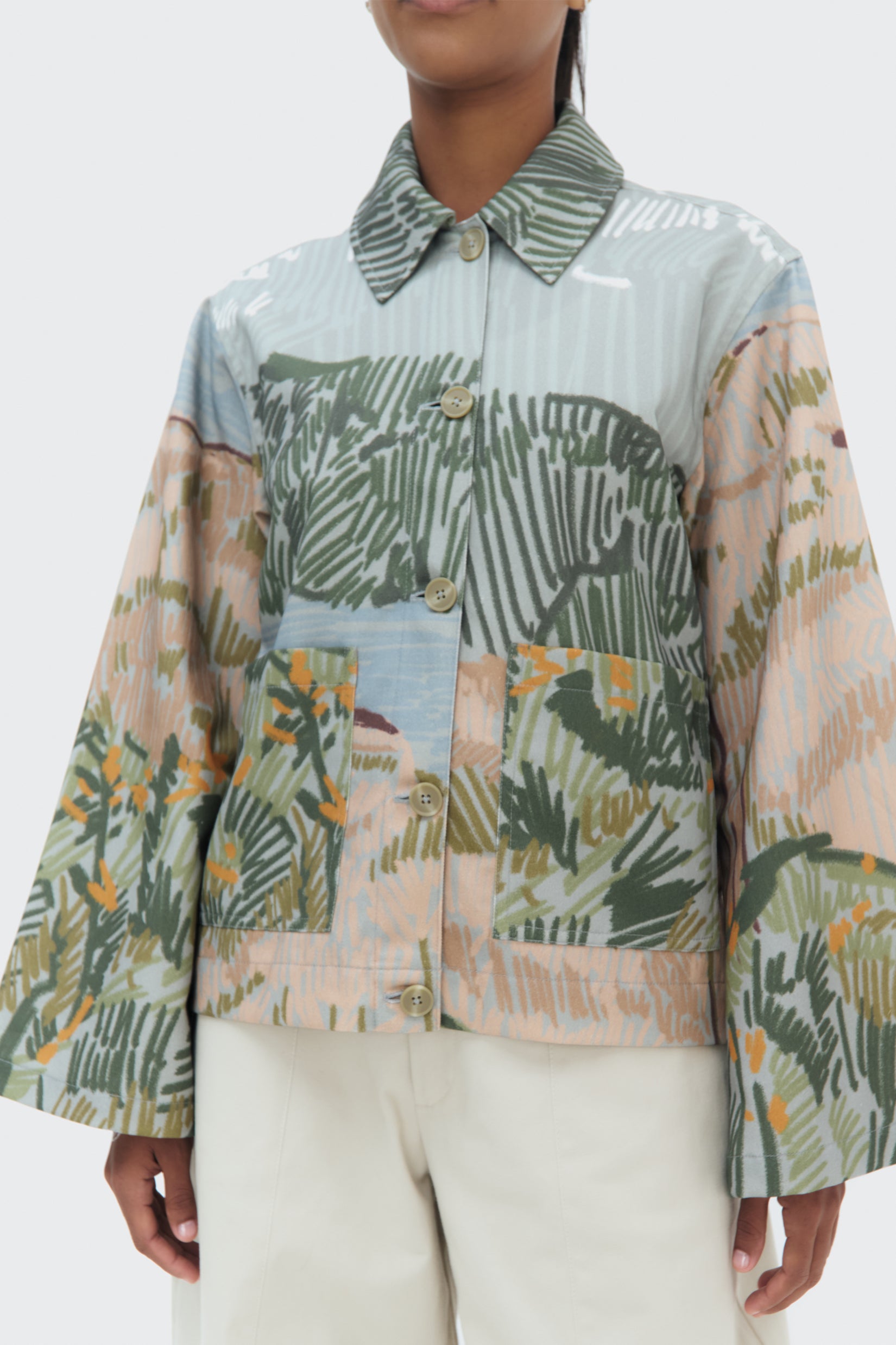 Detail view of the Bruma Utility Jacket by Olga Fisch featuring an abstract landscape print