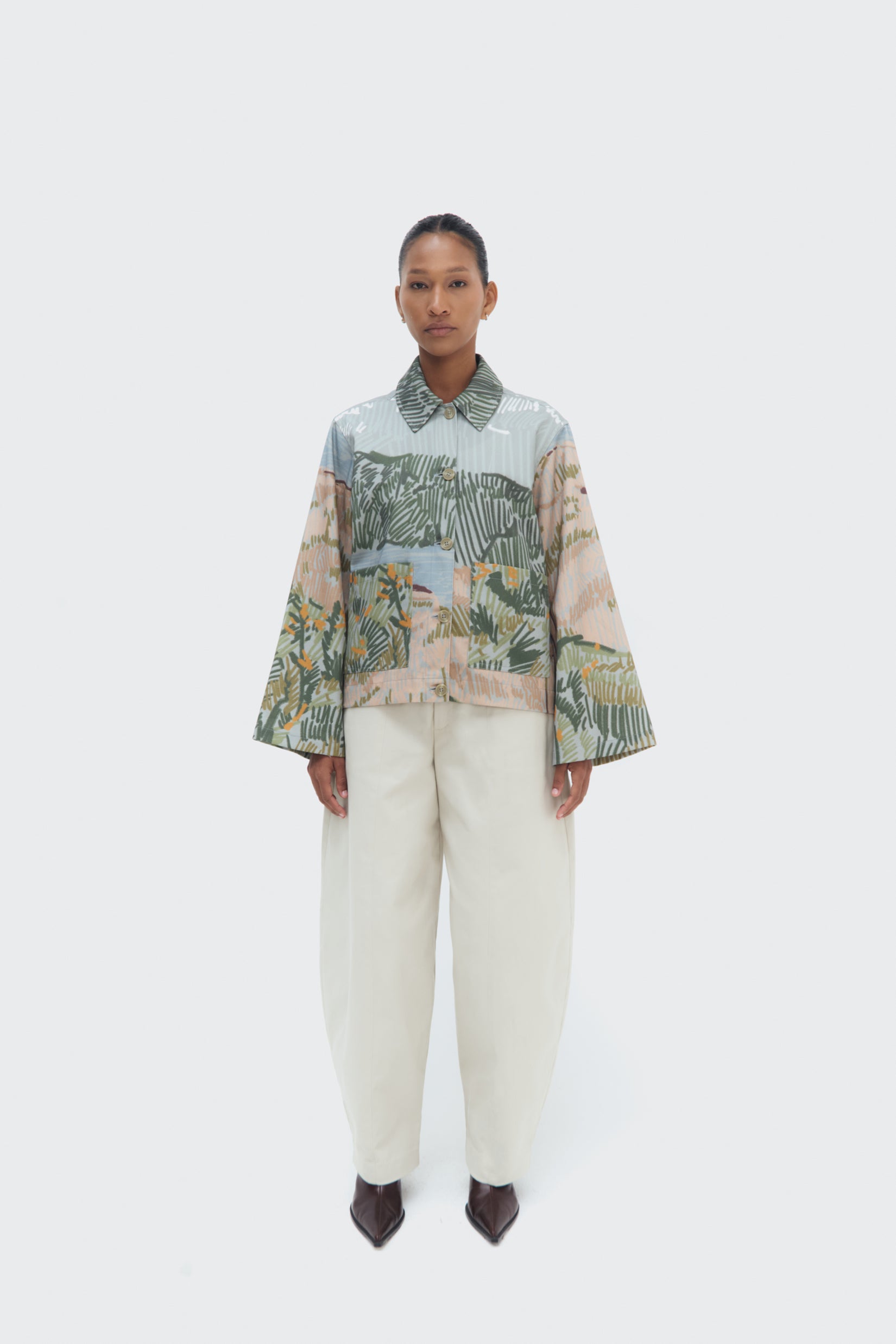 Front view of the Bruma Utility Jacket by Olga Fisch featuring an abstract landscape print