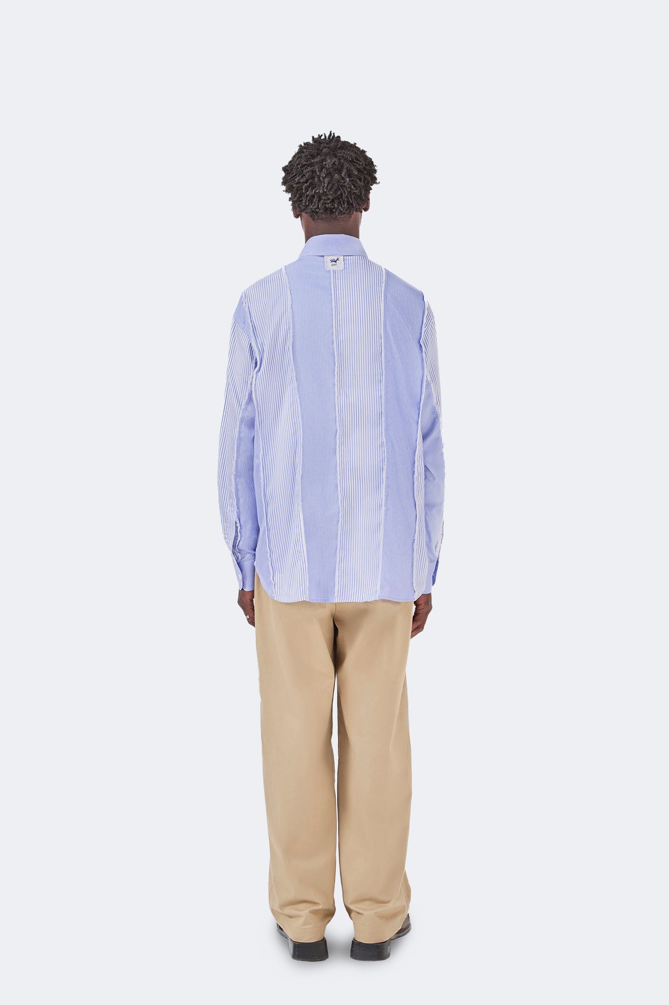 Full back view of the Canoa Blue Striped Shirt in a relaxed fit with long sleeves and curved hem.