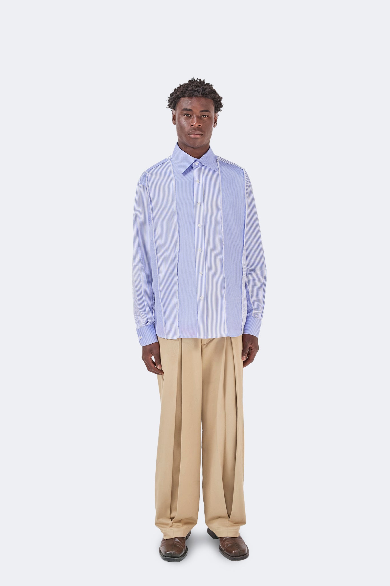 Front view of the Canoa Blue Striped Shirt with relaxed silhouette, long sleeves, and deconstructed panel detailing.