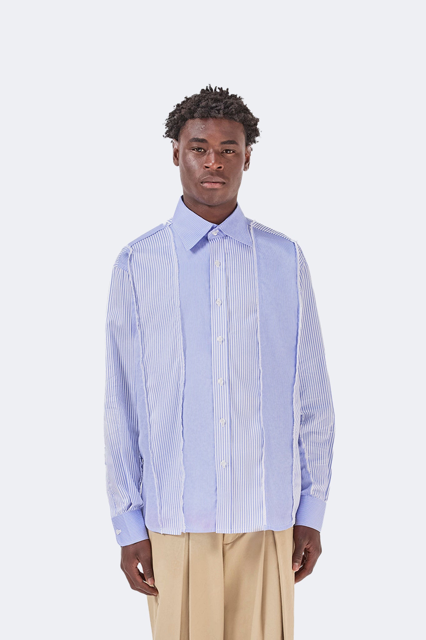 Front detail of the Canoa Blue Striped Cotton Shirt featuring contrasting striped panels, button front, and classic collar.