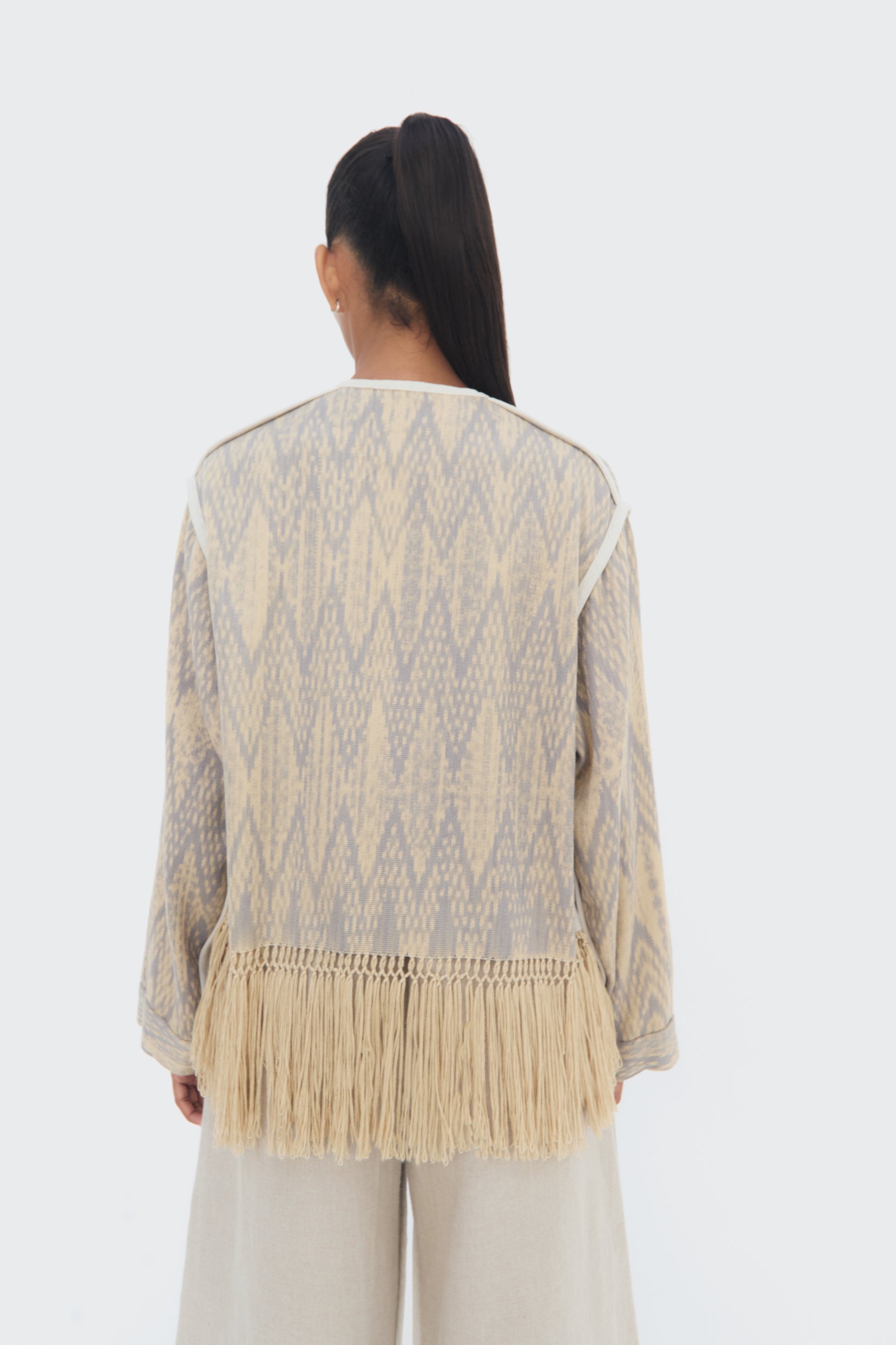 Back View Chakana Jacket by Olga Fisch – handwoven cotton and silk jacket with macramé fringe