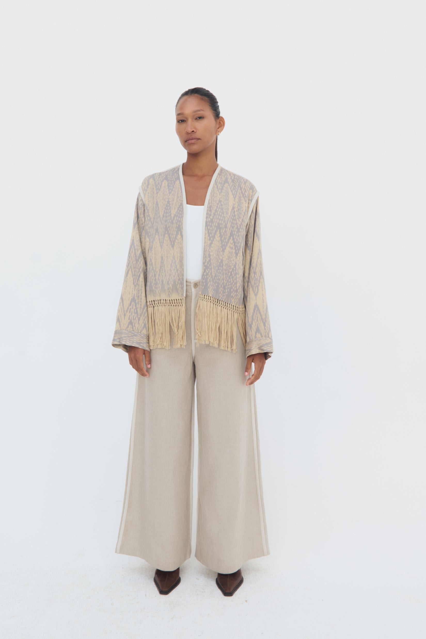 Complete look Chakana Jacket by Olga Fisch – handwoven cotton and silk jacket with macramé fringe.