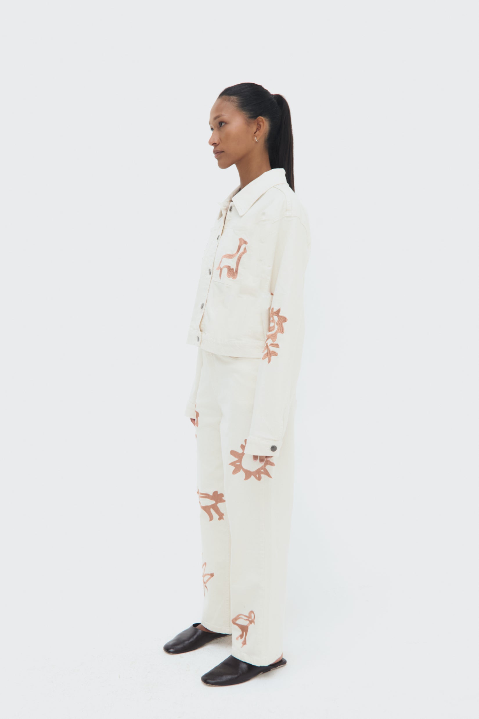 Sideview of Iconos Cropped Jacket – structured silhouette and embroidery details
