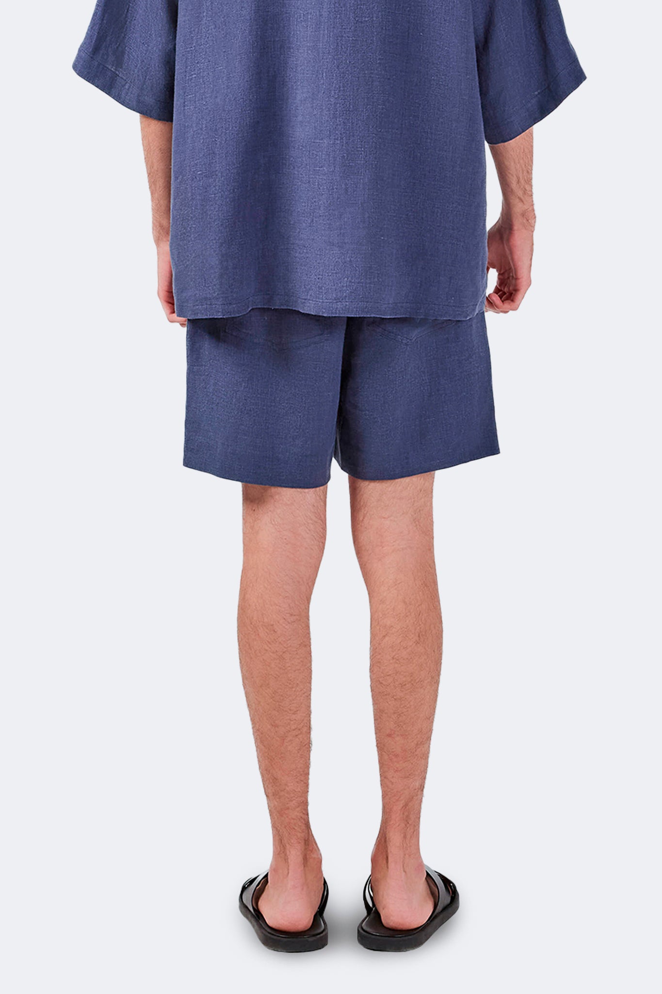 Back detail of Palmira Linen Shorts Indigo crafted from 100% linen with a relaxed fit.
