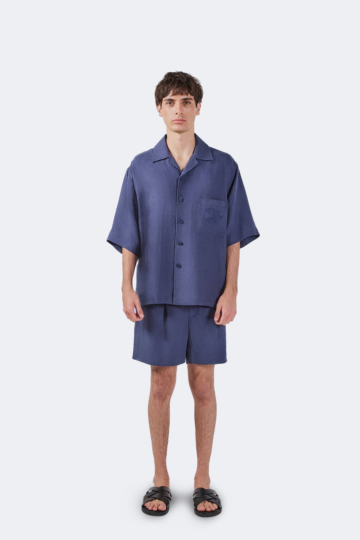 Front view of Palmira Linen Shorts Indigo crafted from breathable 100% linen with a relaxed fit.