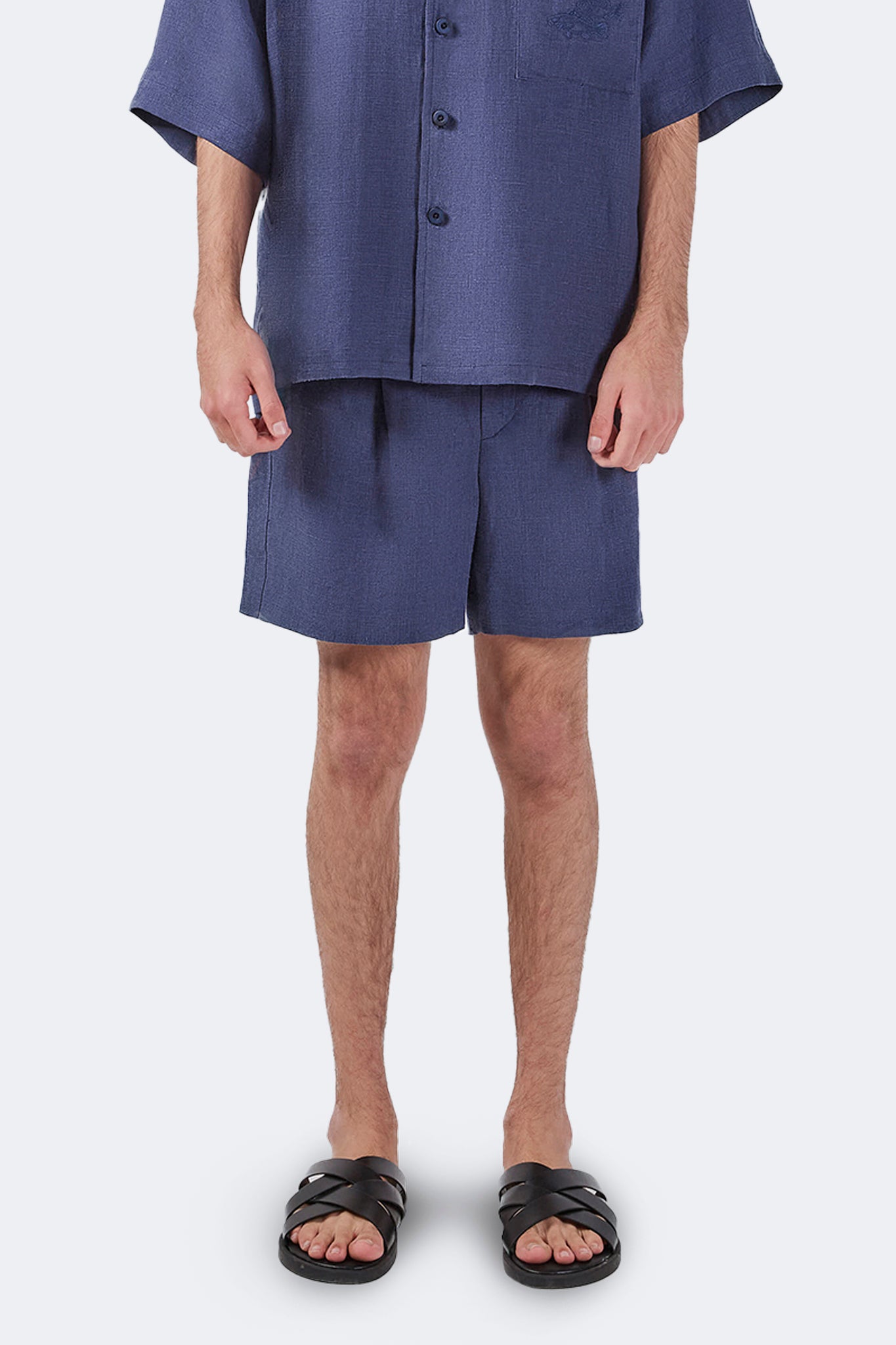Front detail of Palmira Linen Shorts Indigo showing the lightweight linen texture and clean finish.