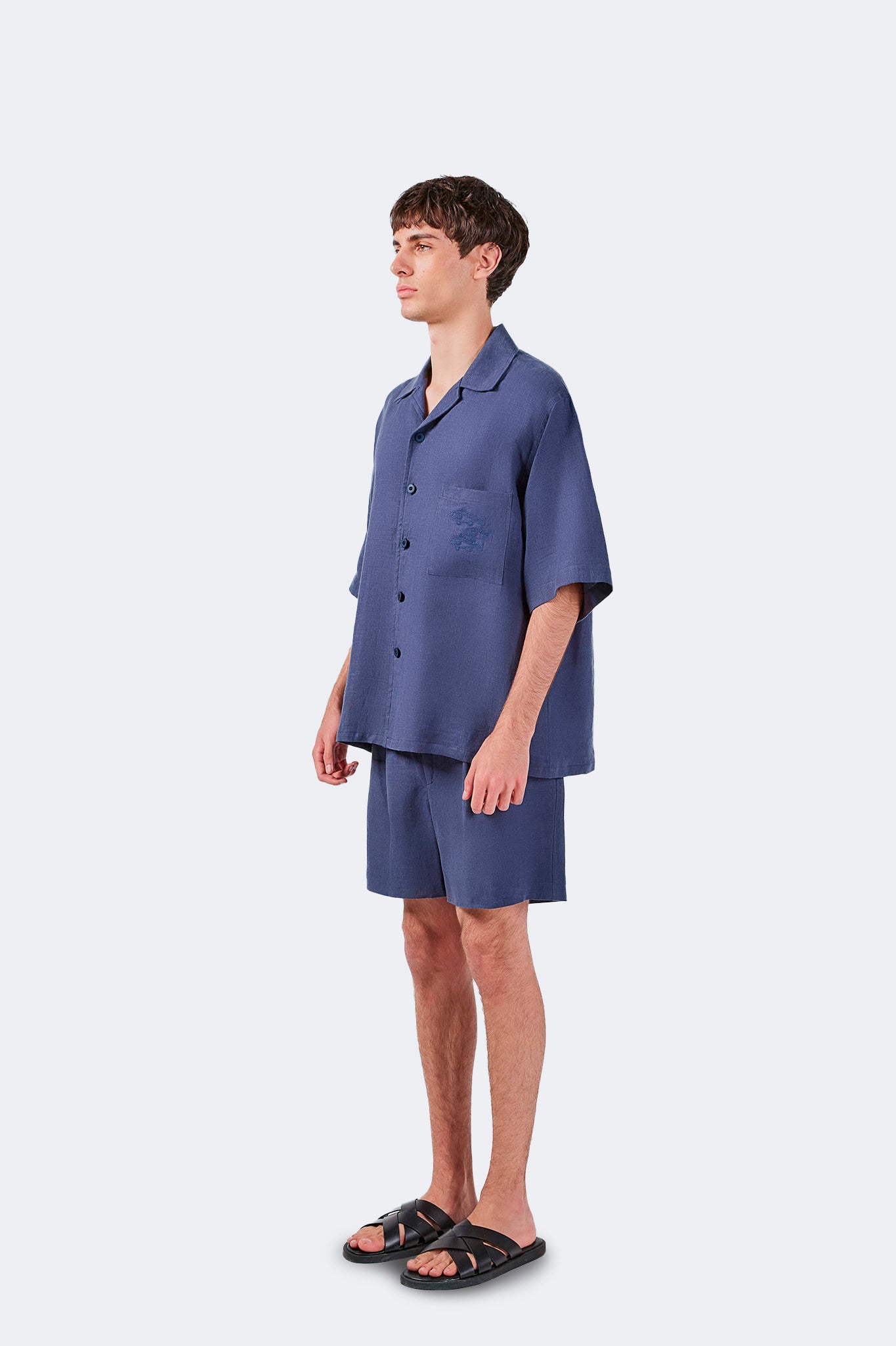 Side view of Palmira Linen Shorts Indigo with a relaxed silhouette and contemporary styling.