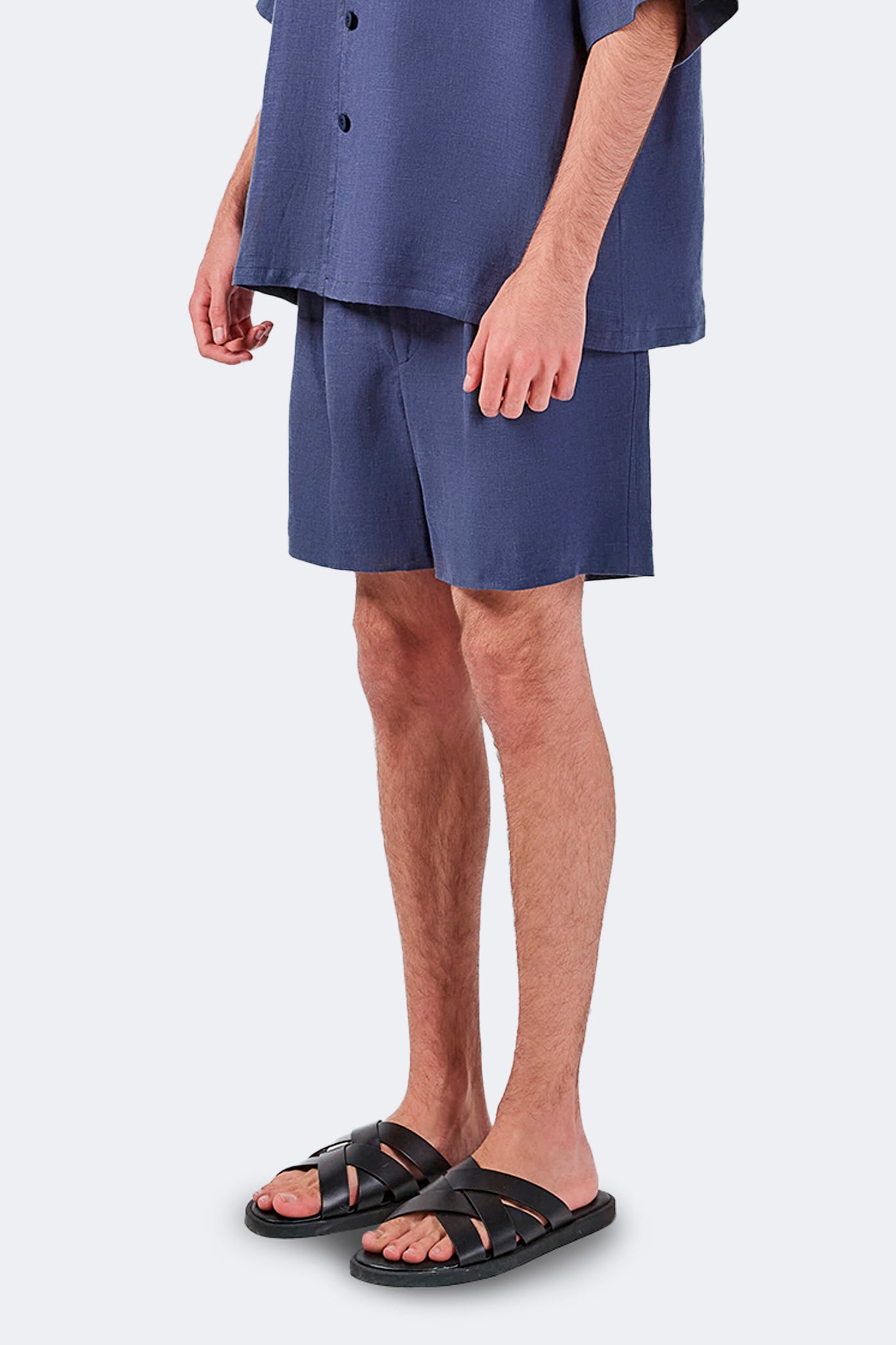 Side detail of Palmira Linen Shorts Indigo highlighting the natural drape of lightweight linen.