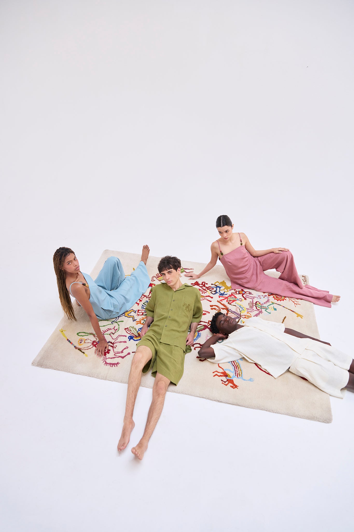 Editorial image featuring the Jama Linen Strapped Top Spondylus, Jama Strapped Top- sky, San Cristobal Shorts- Sleeved Shirt and Baltra Short- Sleeved Shirt.