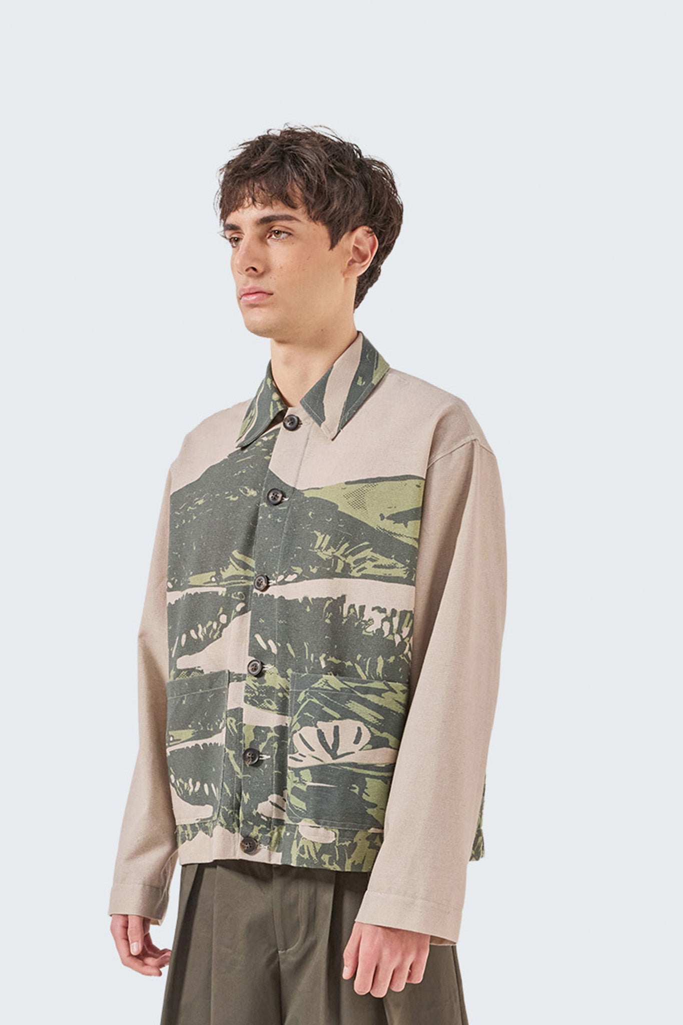 Close-up side view of the Kikuyo Workman Jacket featuring archive-inspired landscape print on 100% linen fabric.