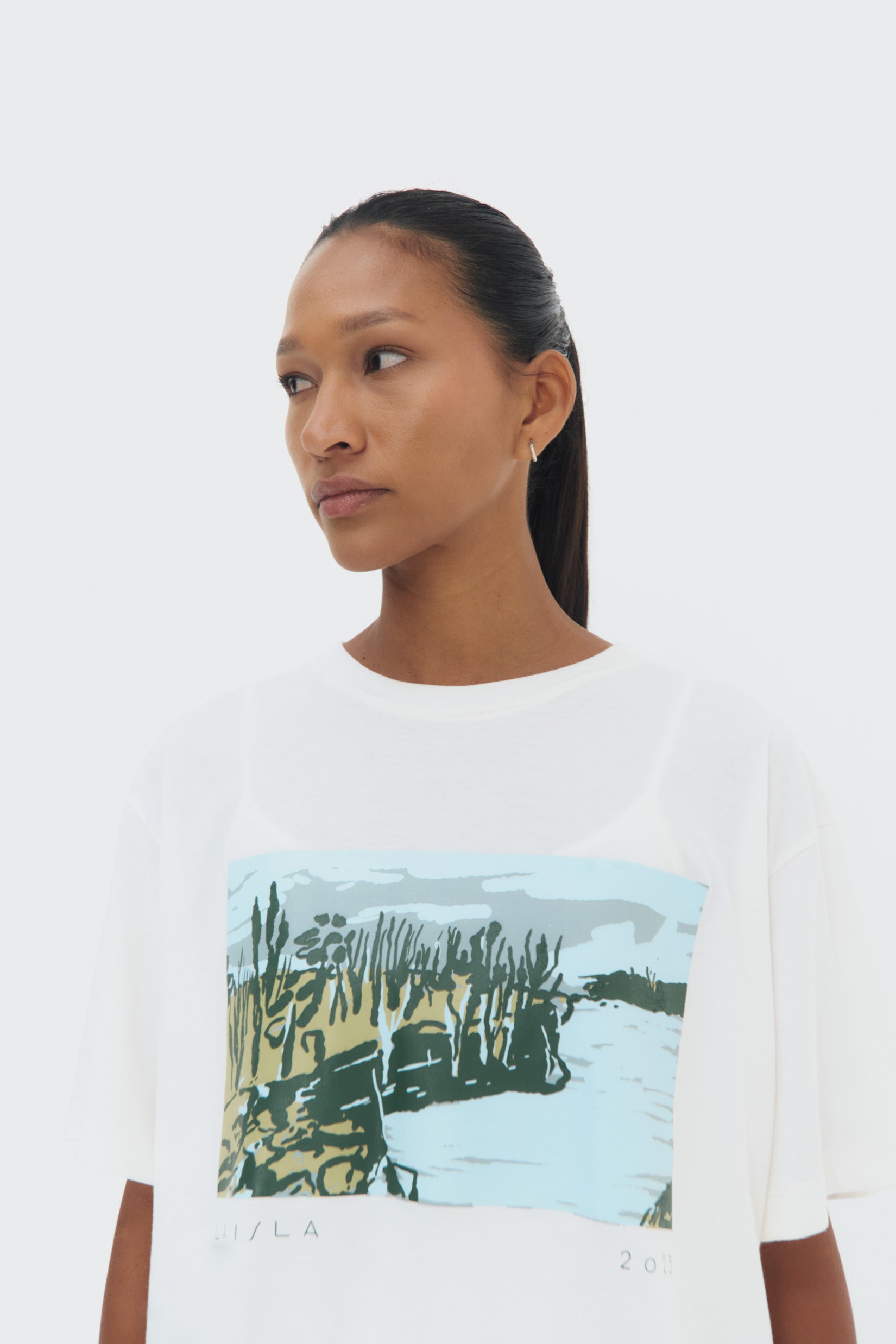 Side View La Isla T-Shirt by Olga Fisch – cotton tee with art-inspired print