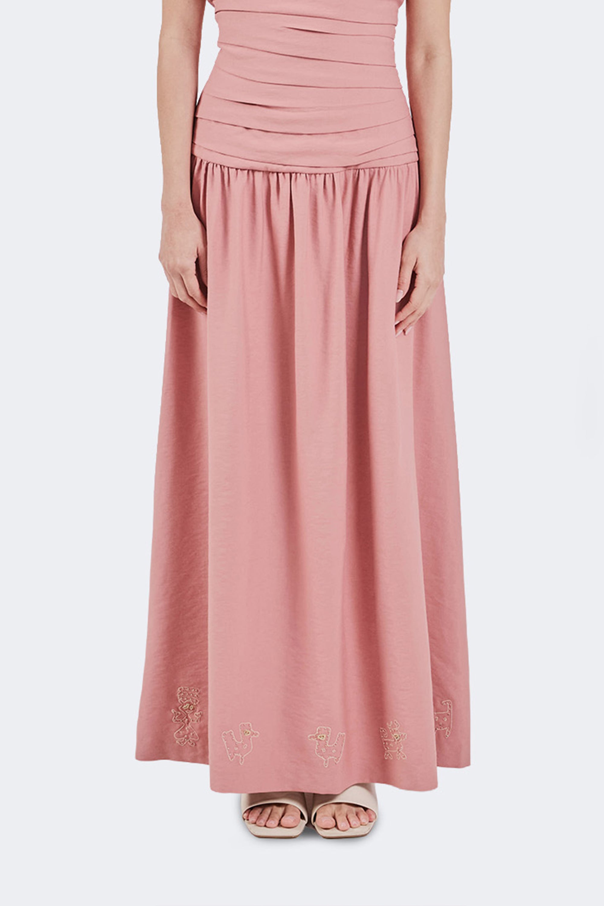 Pink dress with details on a white background