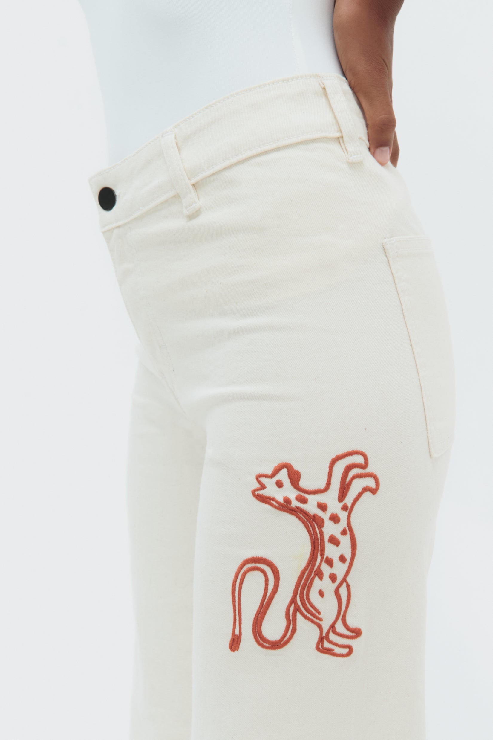 Detail view of Munay Jeans by Olga Fisch showing embroidered details on cotton denim