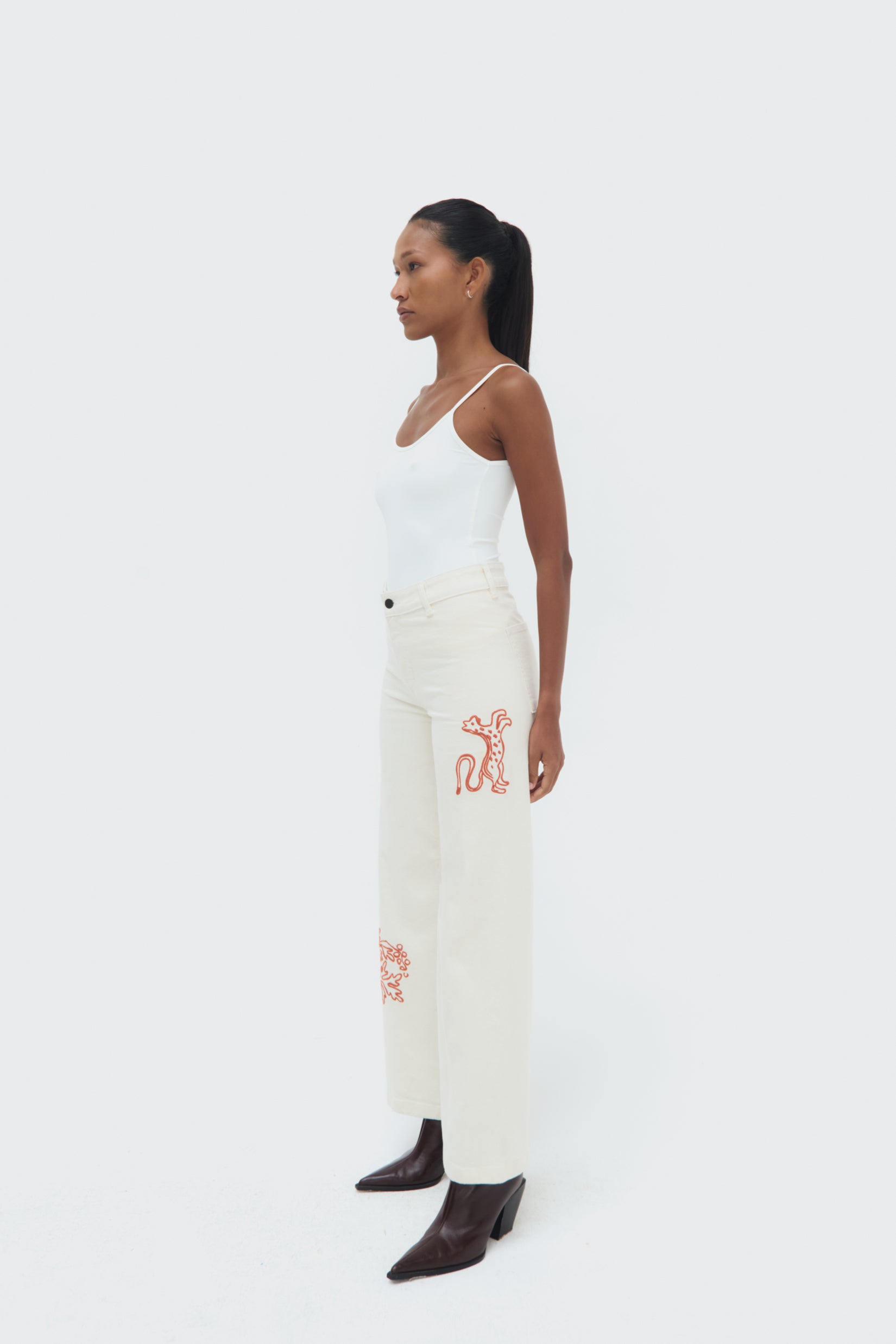 Sideview of Munay Jeans by Olga Fisch showing embroidered details on cotton denim