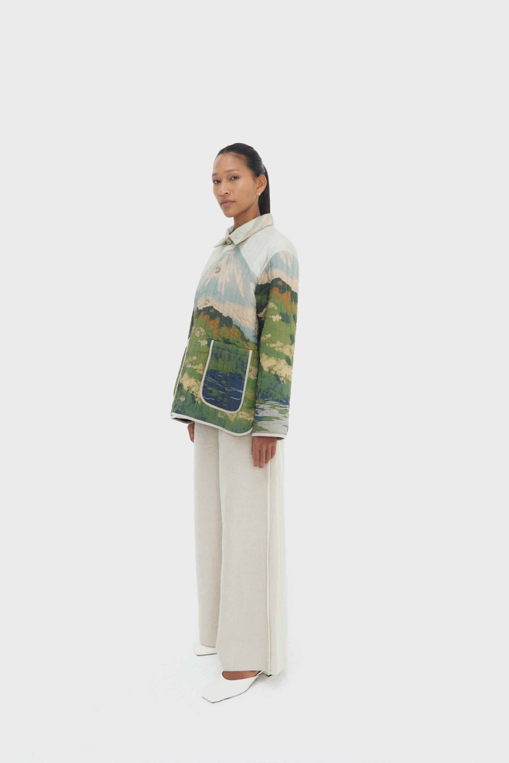 Side view of the Bruma Utility Jacket by Olga Fisch featuring an abstract landscape print
