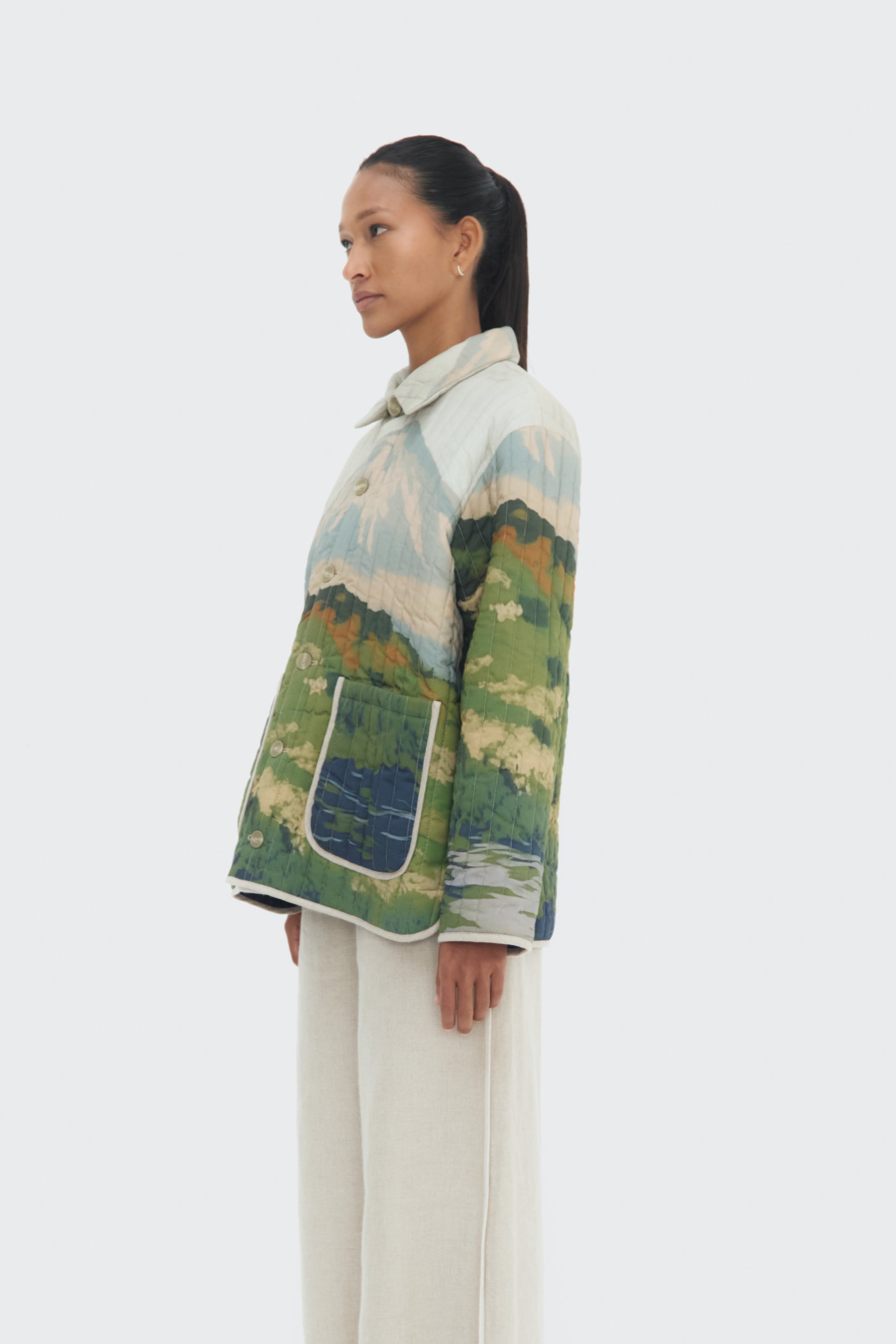 Side view of the Bruma Utility Jacket by Olga Fisch featuring an abstract landscape print