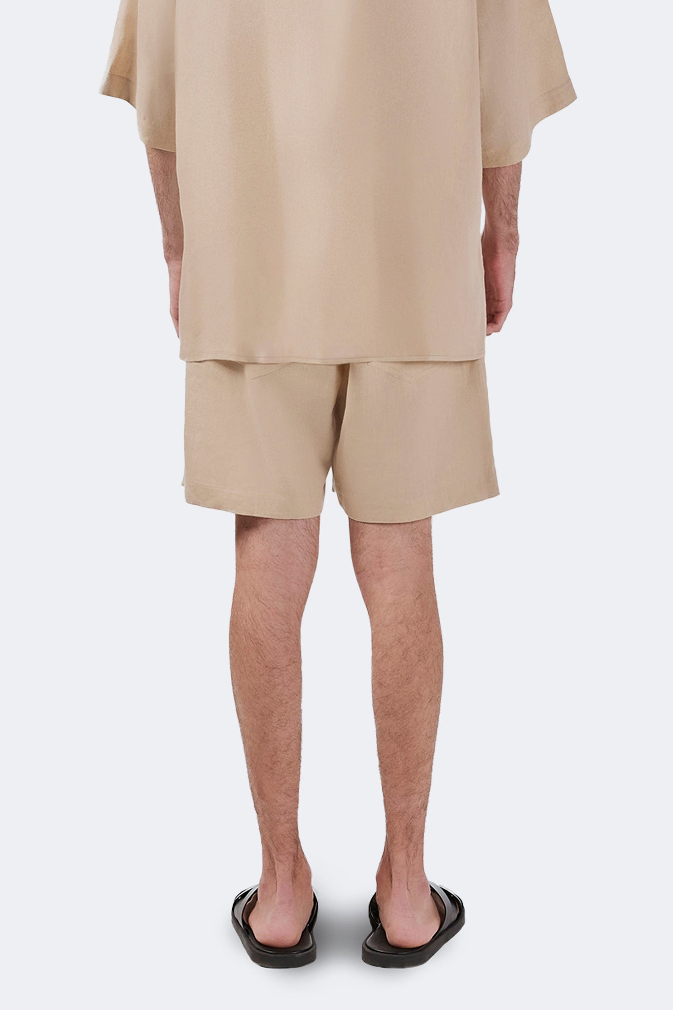 Back detail of the Palmira Linen Shorts Ivory showcasing lightweight linen, clean construction, and relaxed fit.