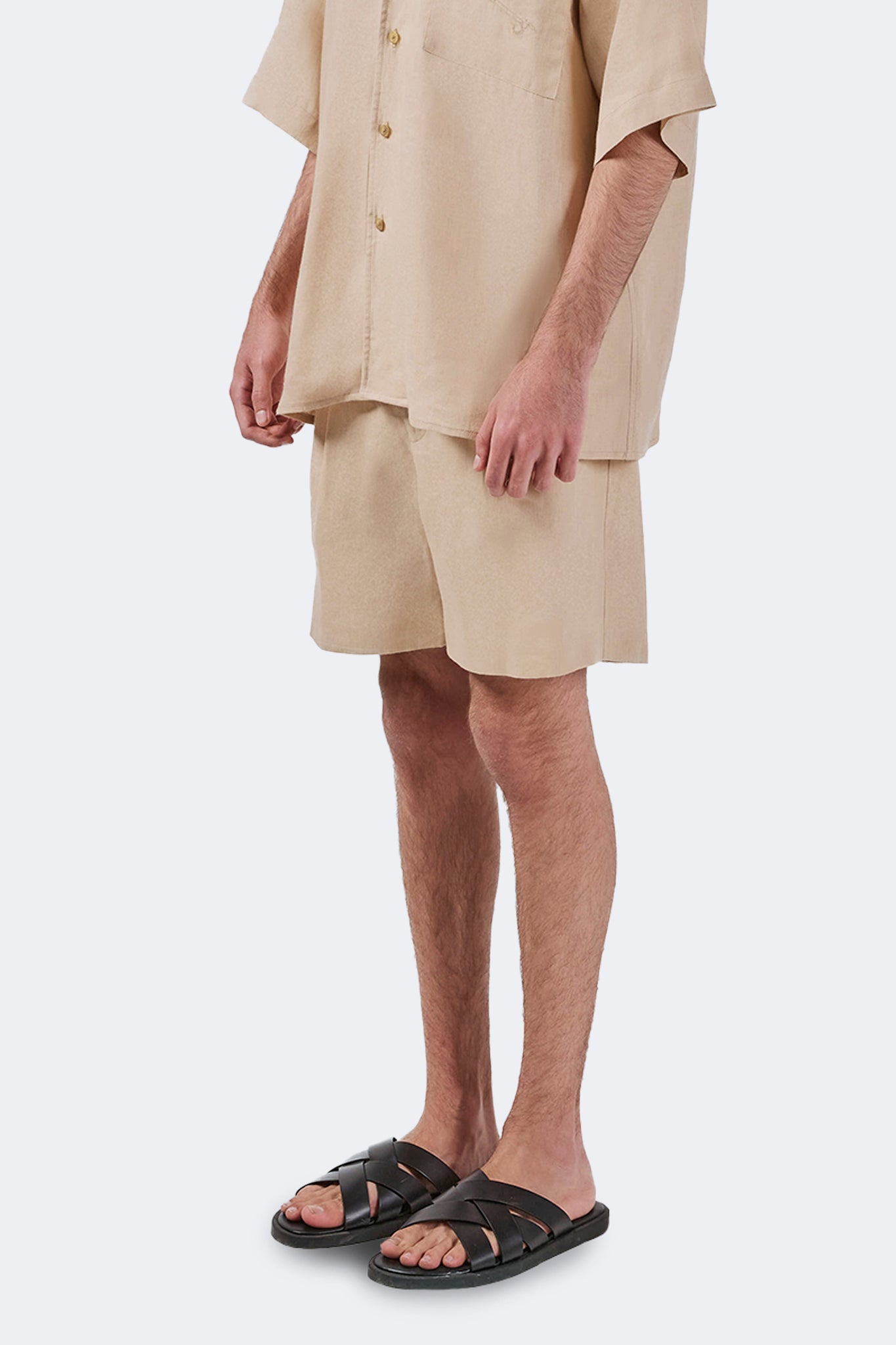 Side detail of the Palmira Linen Shorts Ivory featuring lightweight linen and a soft structured silhouette.