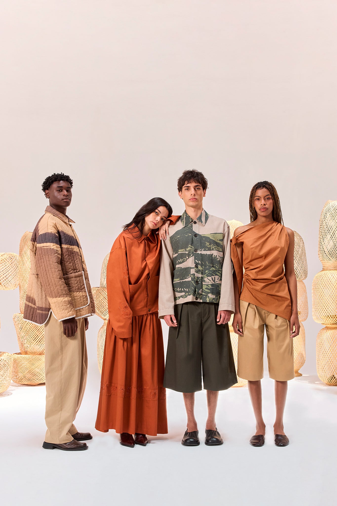 Editorial image featuring the Palmira Quilted Jacket, Tolita Utility Jacket, Kikuyo Workman Jacket and Pambil One Shoulder Knotted Top.