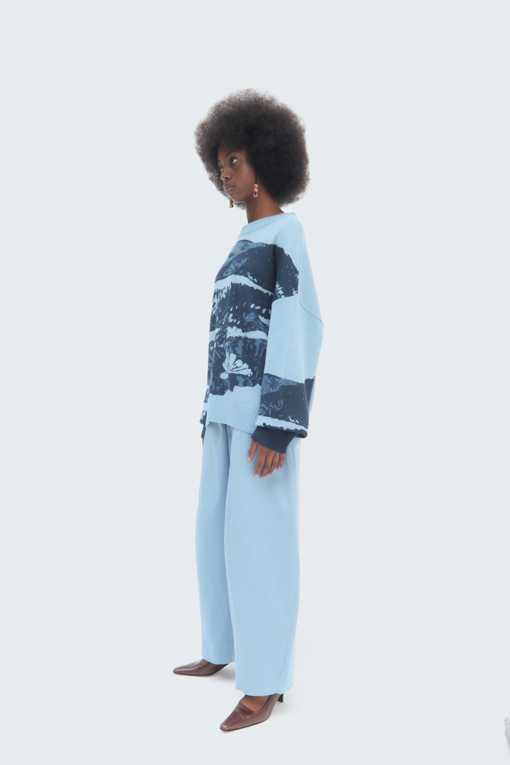Model wearing the Páramo Sweater styled with our Bubble Skye Blue trousers