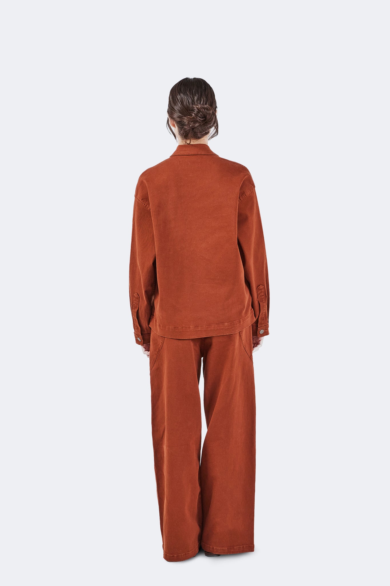 Back view of Payla Jeans in Brick featuring a wide-leg fit, clean lines, and structured cotton denim.