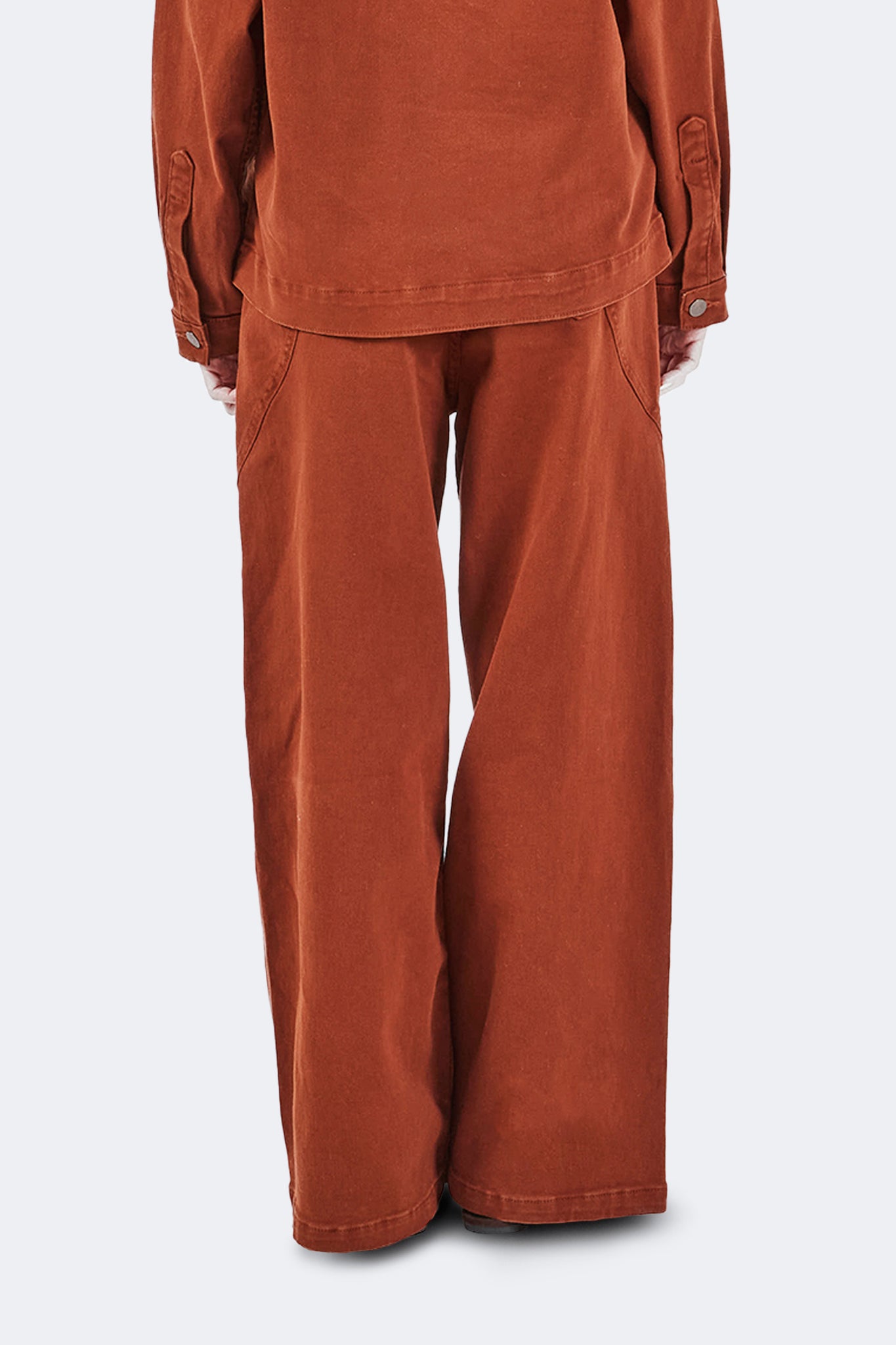 Back view detail of Payla Jeans in Brick, showcasing the relaxed wide-leg silhouette and soft cotton denim construction.