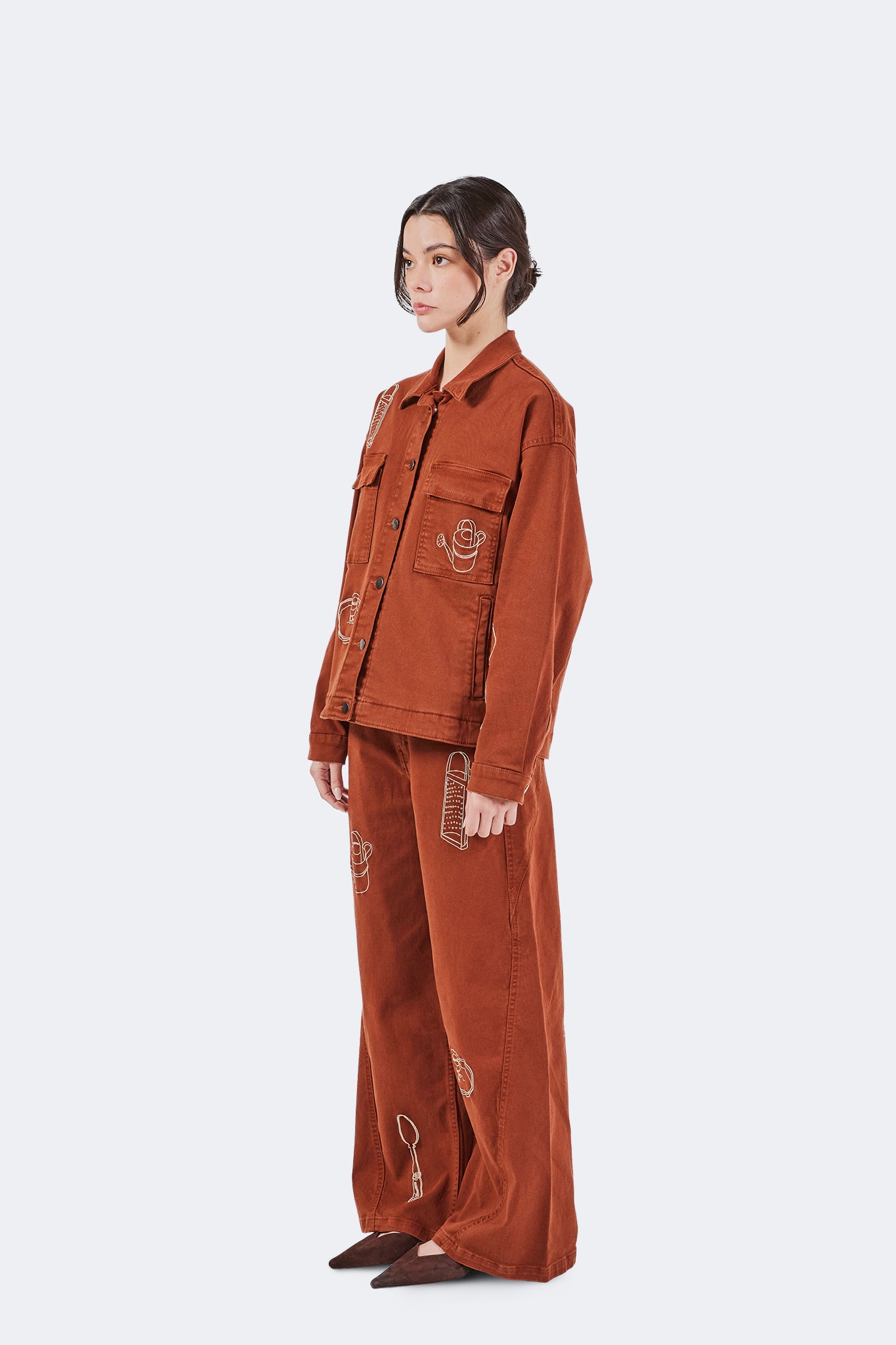 Side view of Payla Jeans in Brick with a fluid wide-leg silhouette and contemporary relaxed fit.