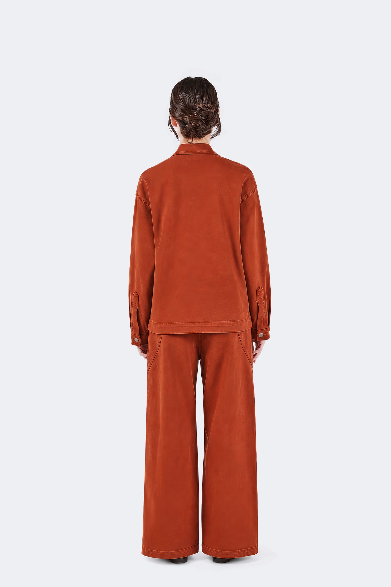 Back view of Payla Jeans in Brick featuring a wide-leg fit, clean lines, and structured cotton denim.