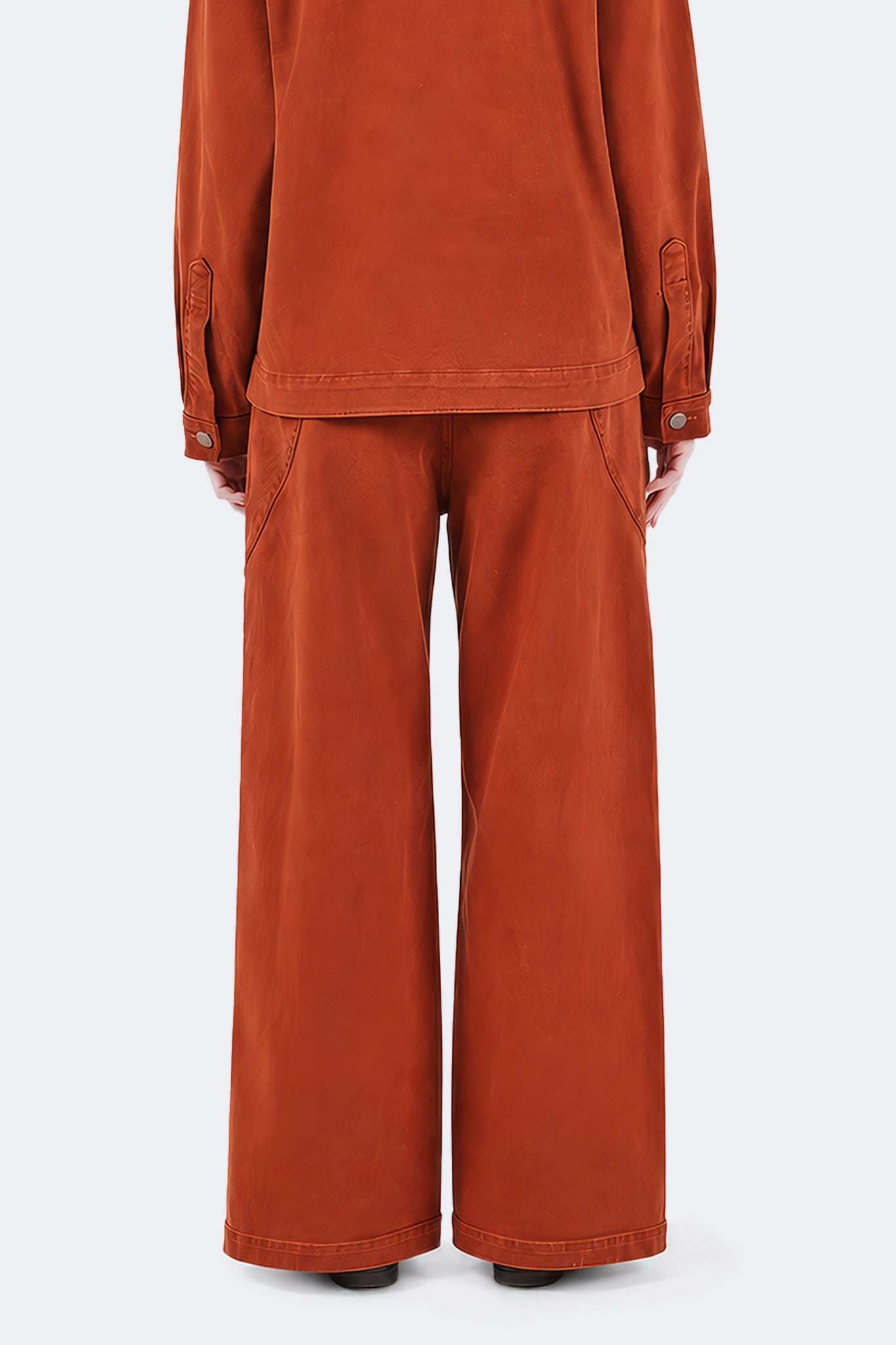 Back view detail of Payla Jeans in Brick, showcasing the relaxed wide-leg silhouette and soft cotton denim construction.