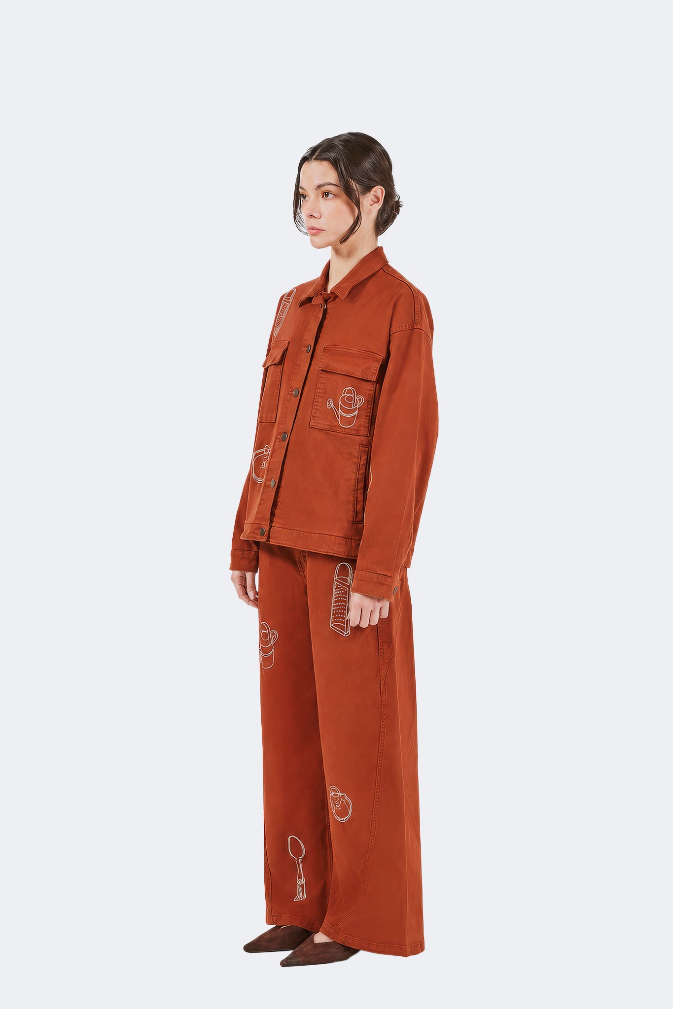 Side view of Payla Jeans in Brick with a fluid wide-leg silhouette and contemporary relaxed fit.