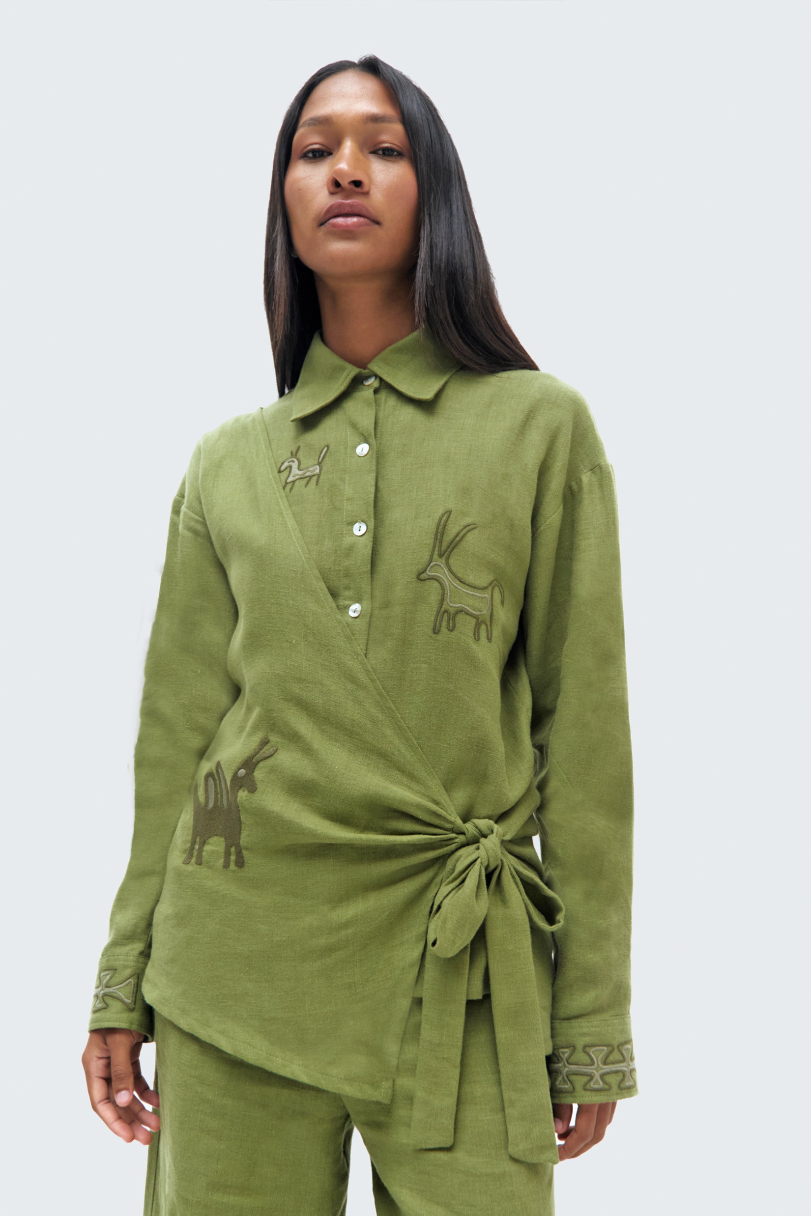 Model close up Pilche Wrapped Blouse by Olga Fisch – linen wrap top with embroidered details