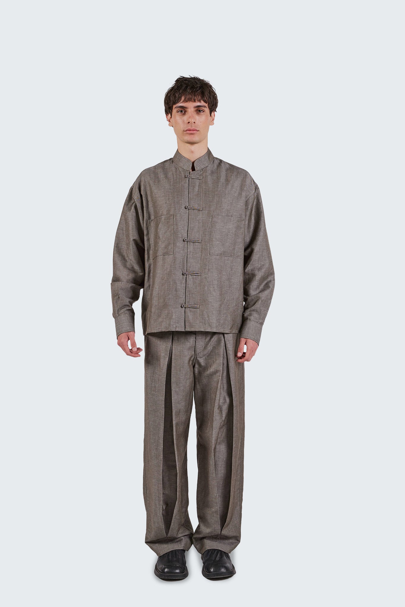 Front view of Pita Double Pleated Trousers featuring double pleats and wide-leg tailoring.