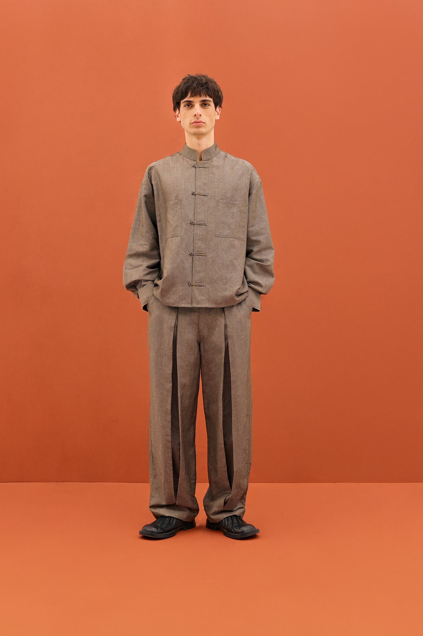 Pita Double Pleated Trousers in Grey with wide-leg fit and double pleat detailing.