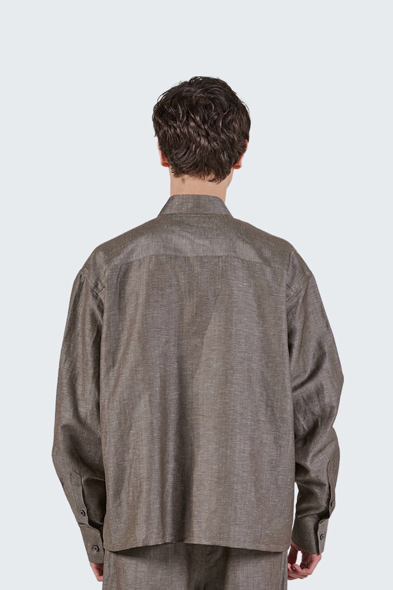 Back detail of the Pita Mao Collared Shirt in grey wool-linen blend featuring relaxed tailoring and clean yoke construction.