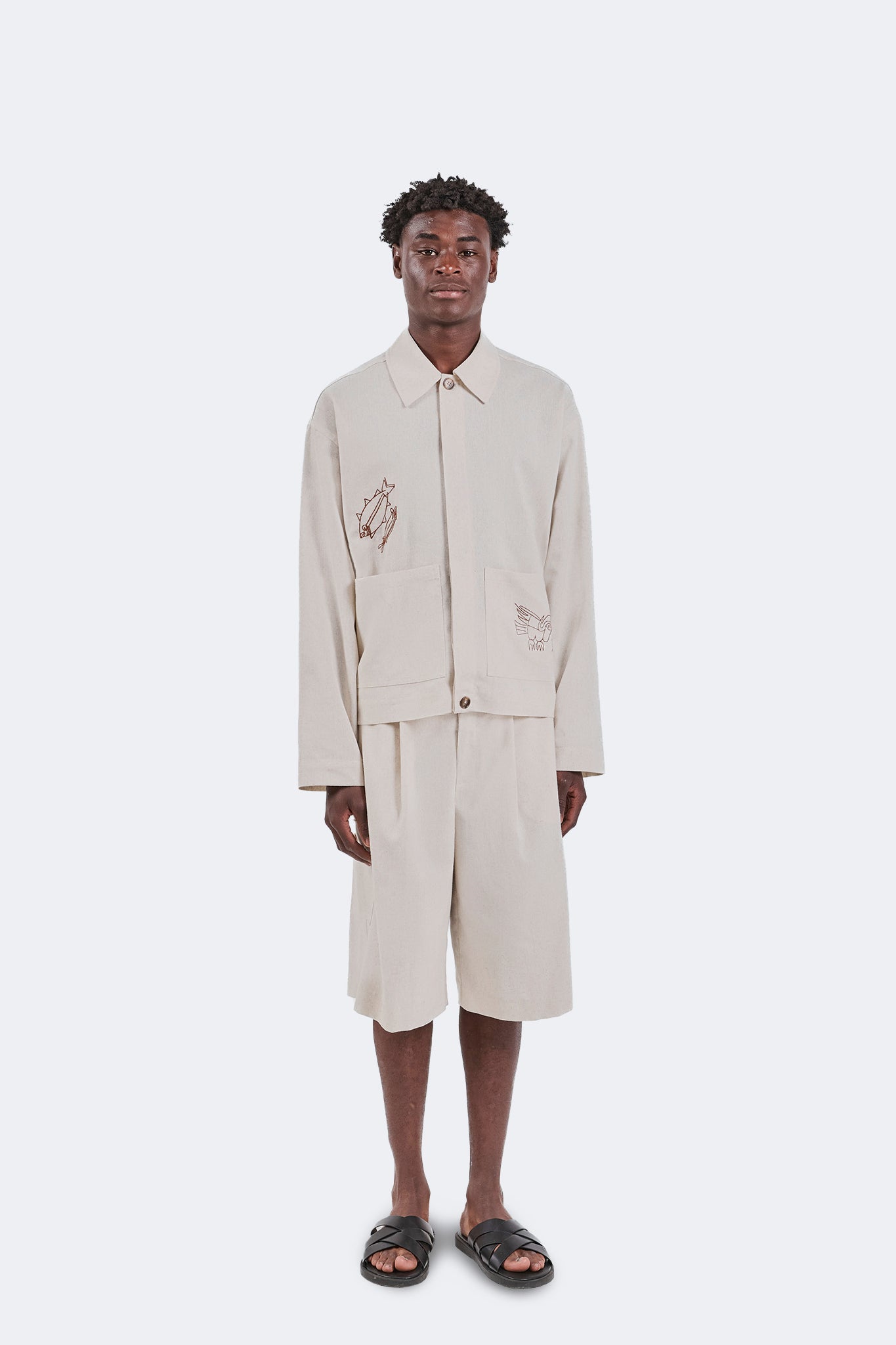 Full front view of the Salango Cargo Jorts in Off-White showcasing the relaxed fit, knee-length silhouette, breathable linen construction, and clean utility styling.