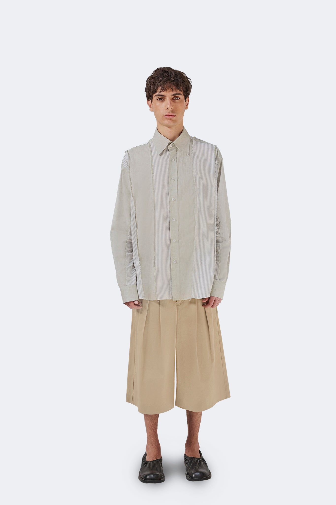 Front view of the Salango Striped Shirt in Baby Moss with a relaxed silhouette, long sleeves, and deconstructed panel detailing.