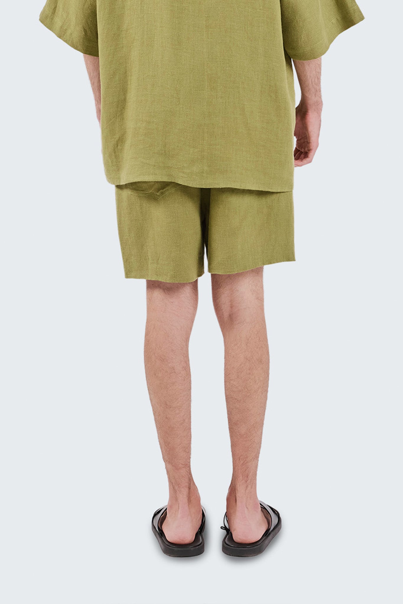 Close-up back view of San Cristobal Linen Shorts featuring rear pocket detailing and the natural texture of linen.