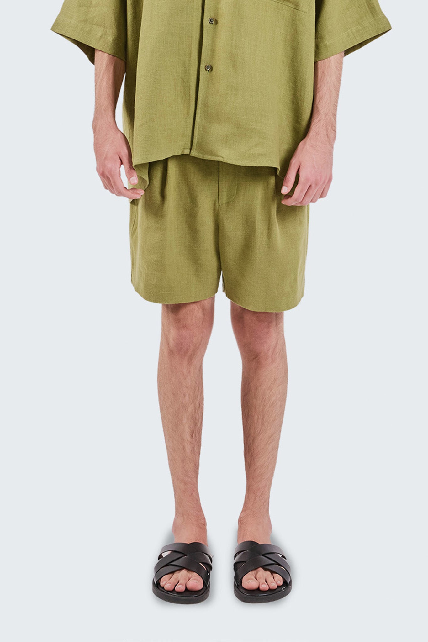 Detailed front view highlighting the lightweight linen fabric, relaxed proportions, and refined construction.